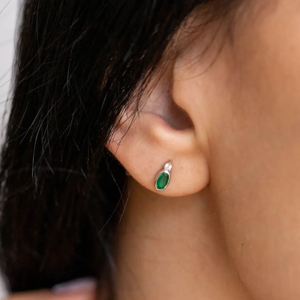 Mismatched Emerald Earrings 14K White Gold pair on ear, featuring dainty natural emerald and diamond stones, perfect gift for May birthdays.
