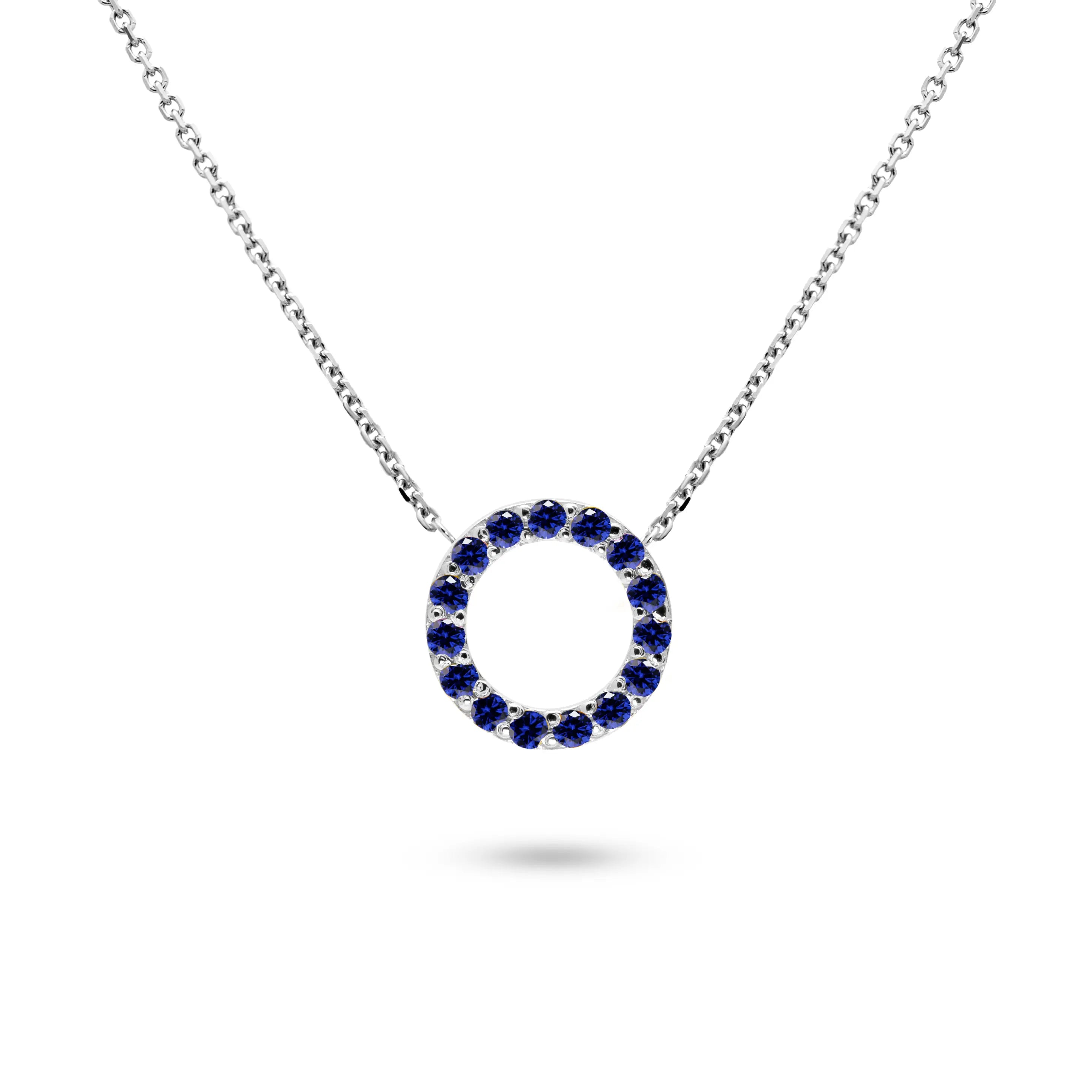 Blue sapphire necklace gold with a circular pendant set in 14K gold, featuring multiple blue sapphires.