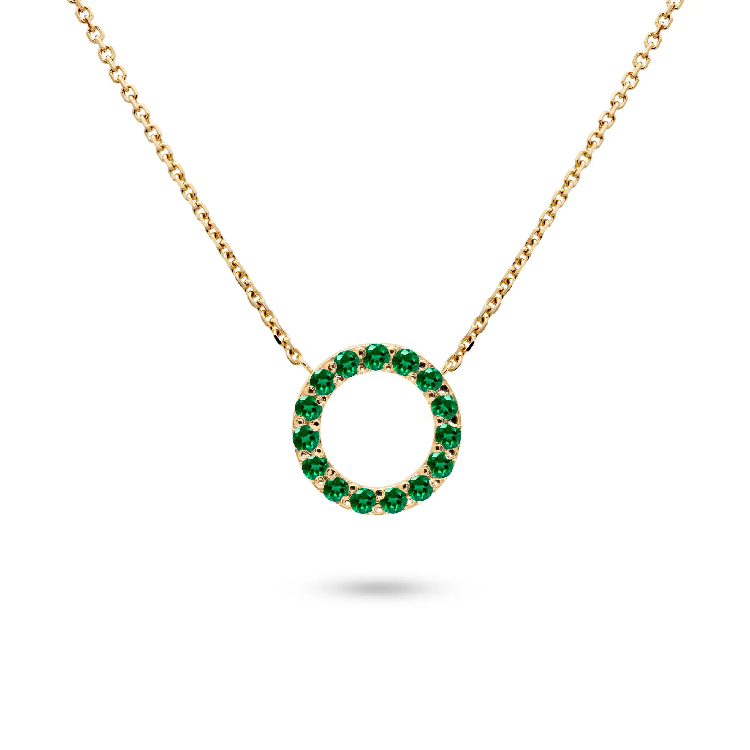 14K gold tsavorite necklace featuring a circle design set with tsavorite gemstones.