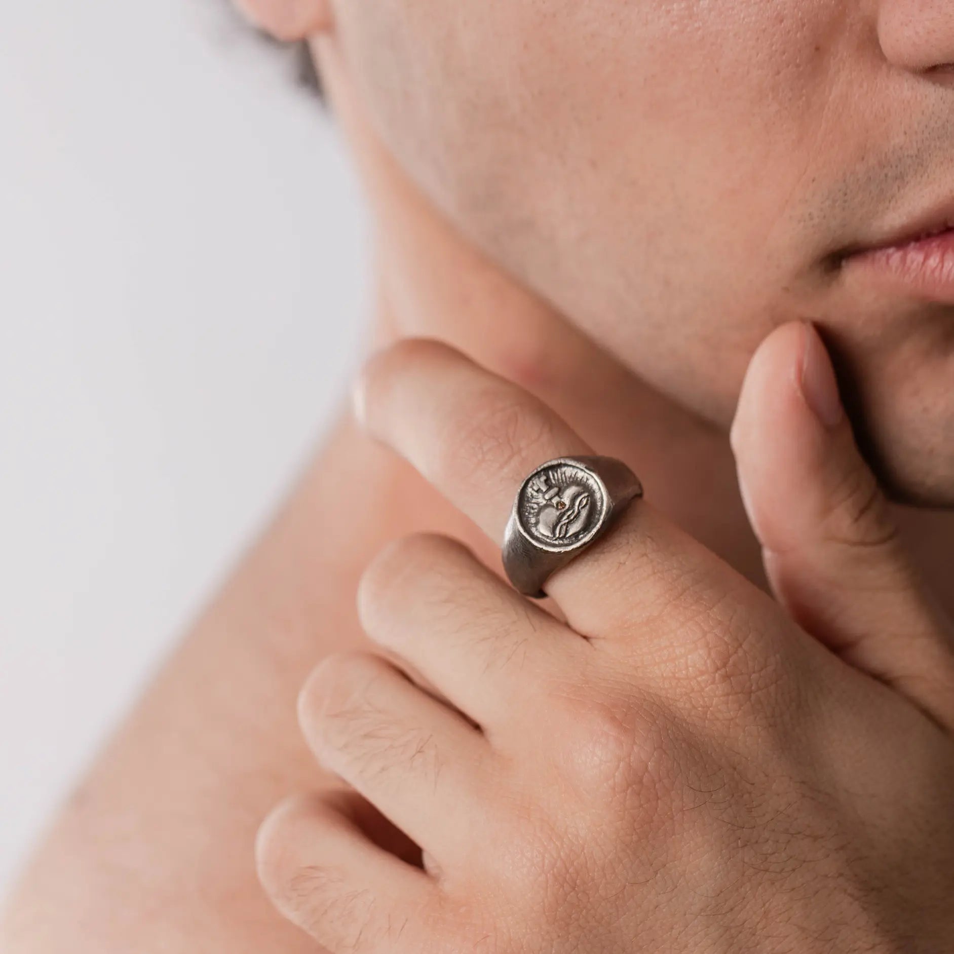 Sacred Heart Ring Brown Diamond Oxidized Silver on man's hand, showcasing black oxidized sterling silver and natural brown diamond.