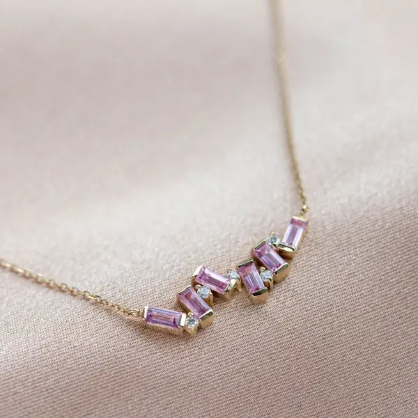 Pink Sapphire Baguette Necklace 14K Gold featuring sapphires and diamonds in asymmetric geometric design on a gold chain.