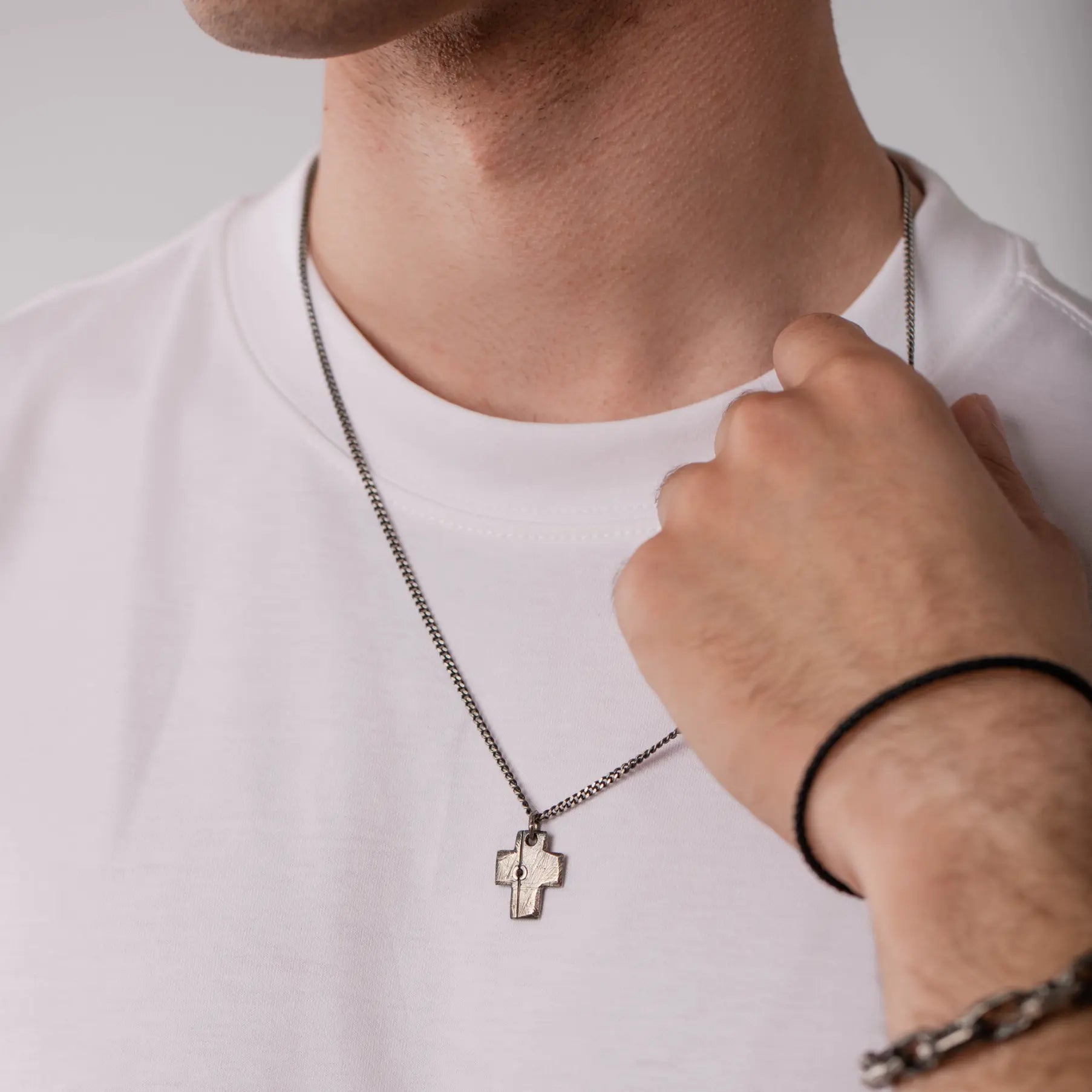 Man wearing Cross Necklace Black Diamond Oxidized Silver 925 pendant, ideal for gifts, showcasing handcrafted sterling silver jewelry.