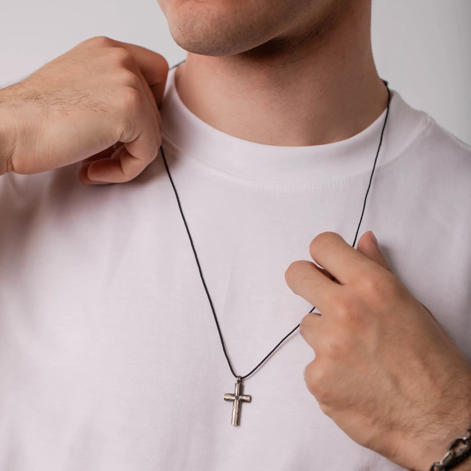 Man wearing Cross Necklace Black Diamond Oxidized Silver with sterling silver cross pendant, suitable for gifts for men and women.