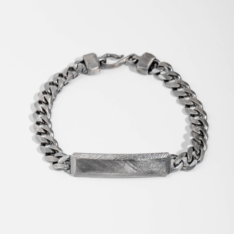 Personalized sterling silver ID bracelet with faceted bar, men's dark oxidized finish, curb chain, 7mm wide, handcrafted.