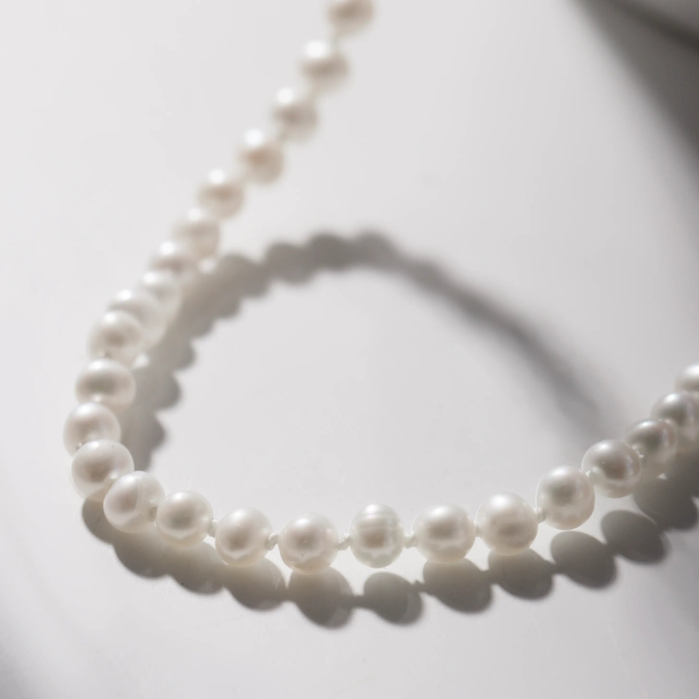 14K Gold Pearl Necklace with natural freshwater pearls and solid gold clasp, 16 inches, elegant gift packaging included.
