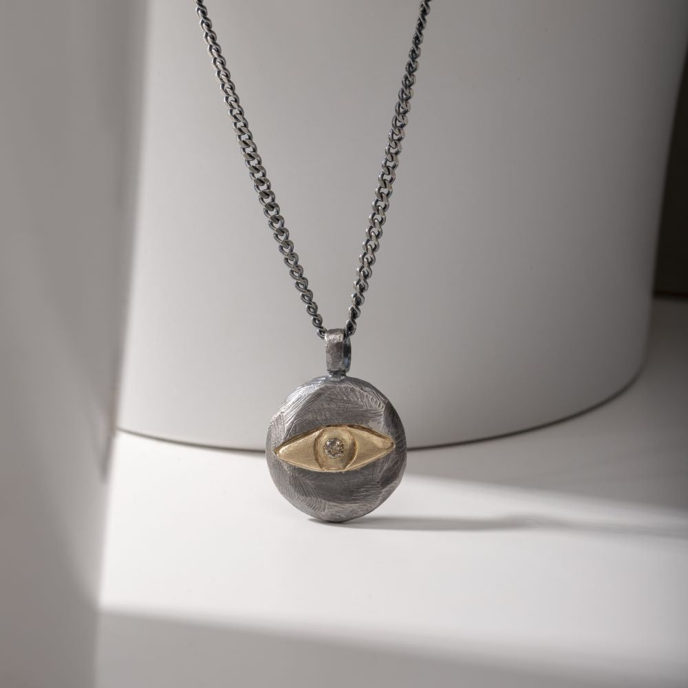 Evil Eye Necklace Brown Diamond Oxidized Silver 14K Gold featuring a handmade sterling silver pendant with 14K gold detail.