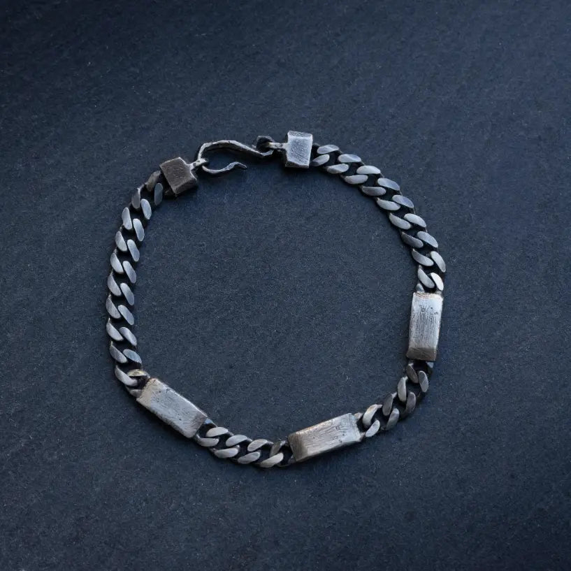 Close-up of Men's 5.5mm Personalized Tag Bracelet in Sterling Silver