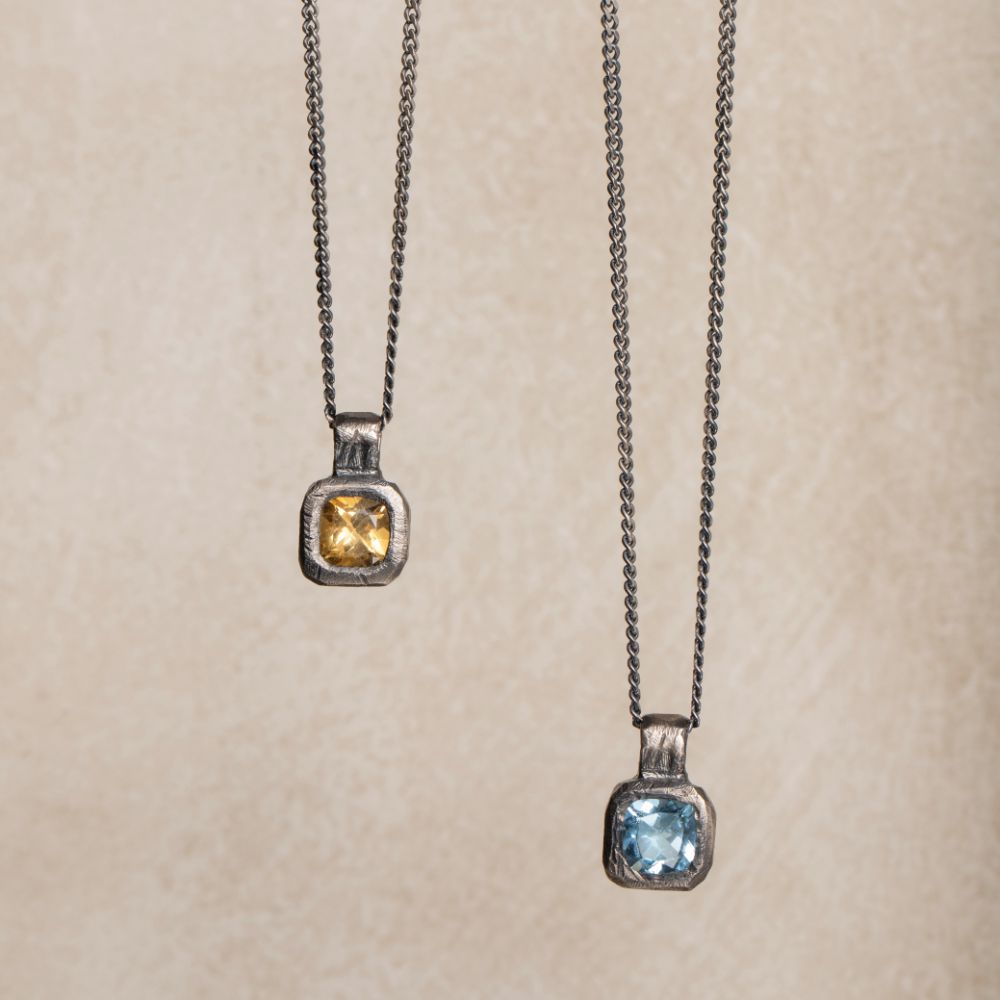 Blue Topaz Necklace Oxidized Silver 925 featuring hand-carved pendant with topaz gemstone on sterling silver chain.