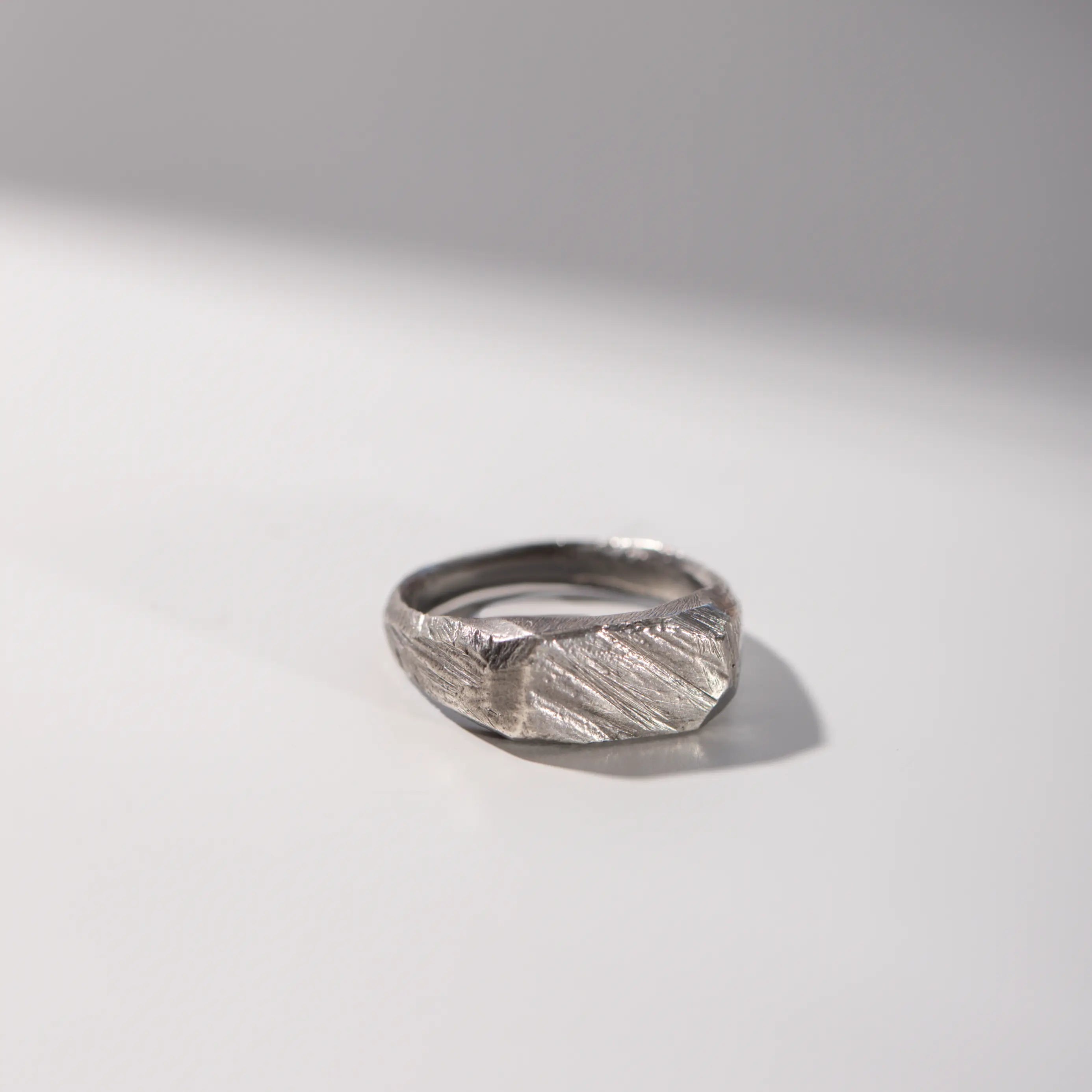 Rectangle Ring Oxidized Silver in black with brutalist style, handcrafted in 925 sterling silver, 8mm width, on a white background.