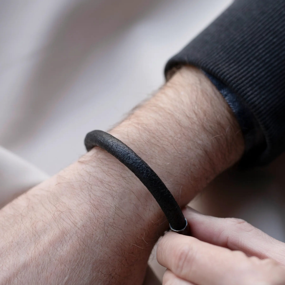 Men's Leather Bracelet with Oxidized Silver Clasp worn on a man's wrist
