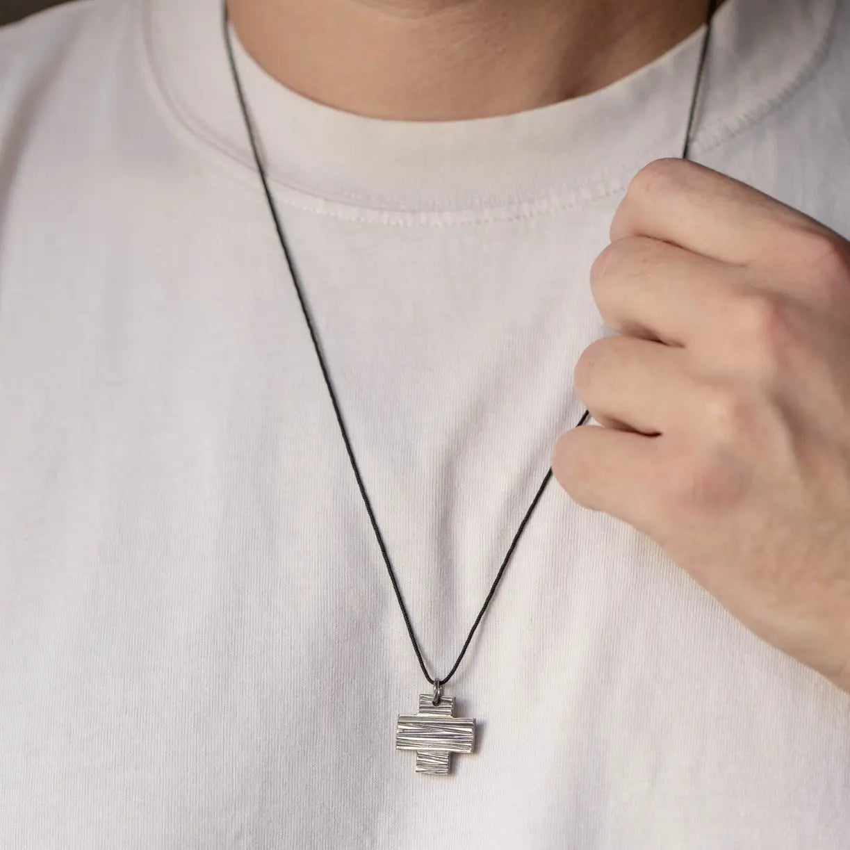 Man wearing Square Cross Necklace Oxidized Silver 925 with black oxidized finish, handmade sterling silver cross pendant, perfect for gifts.