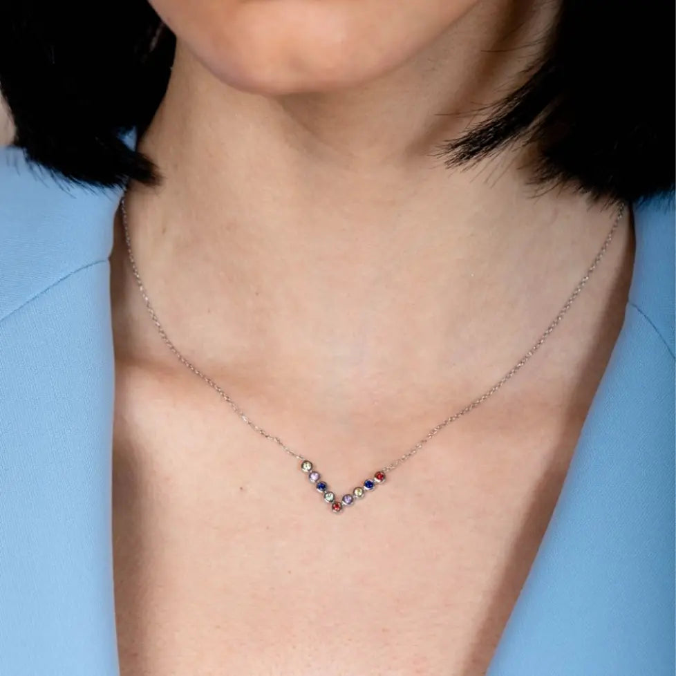 Multicolor Sapphire V Bar Necklace 14K in white gold worn by a model, showcasing colorful 2mm sapphires, elegant design.