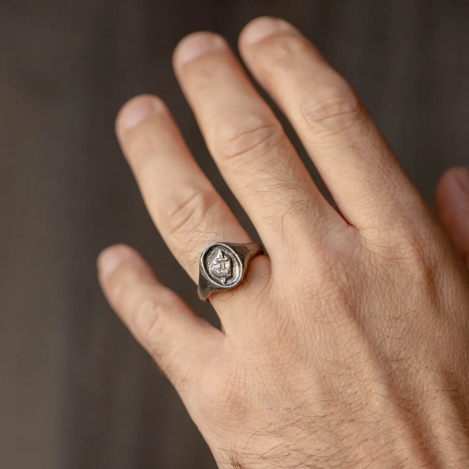 Heart Ring Oxidized Silver 925 on a hand, showcasing brutalist style and oval design, made from high quality black oxidized sterling silver.