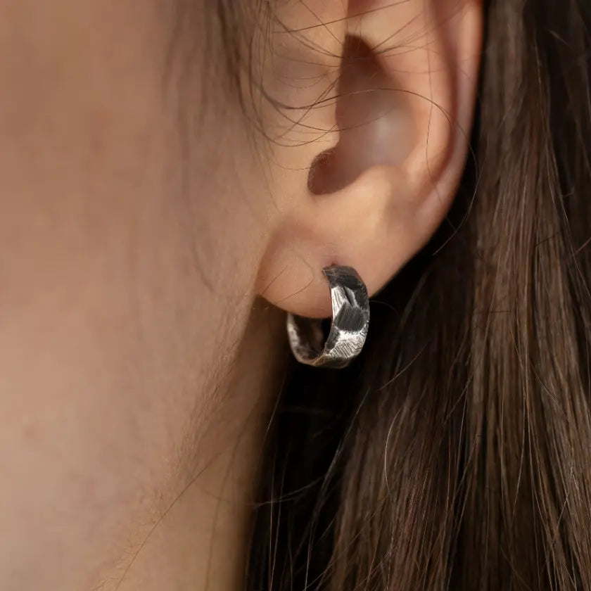 Person wearing Oxidized Silver Hoop Earrings in sterling silver 925, 13mm diameter, handmade, for men and women.