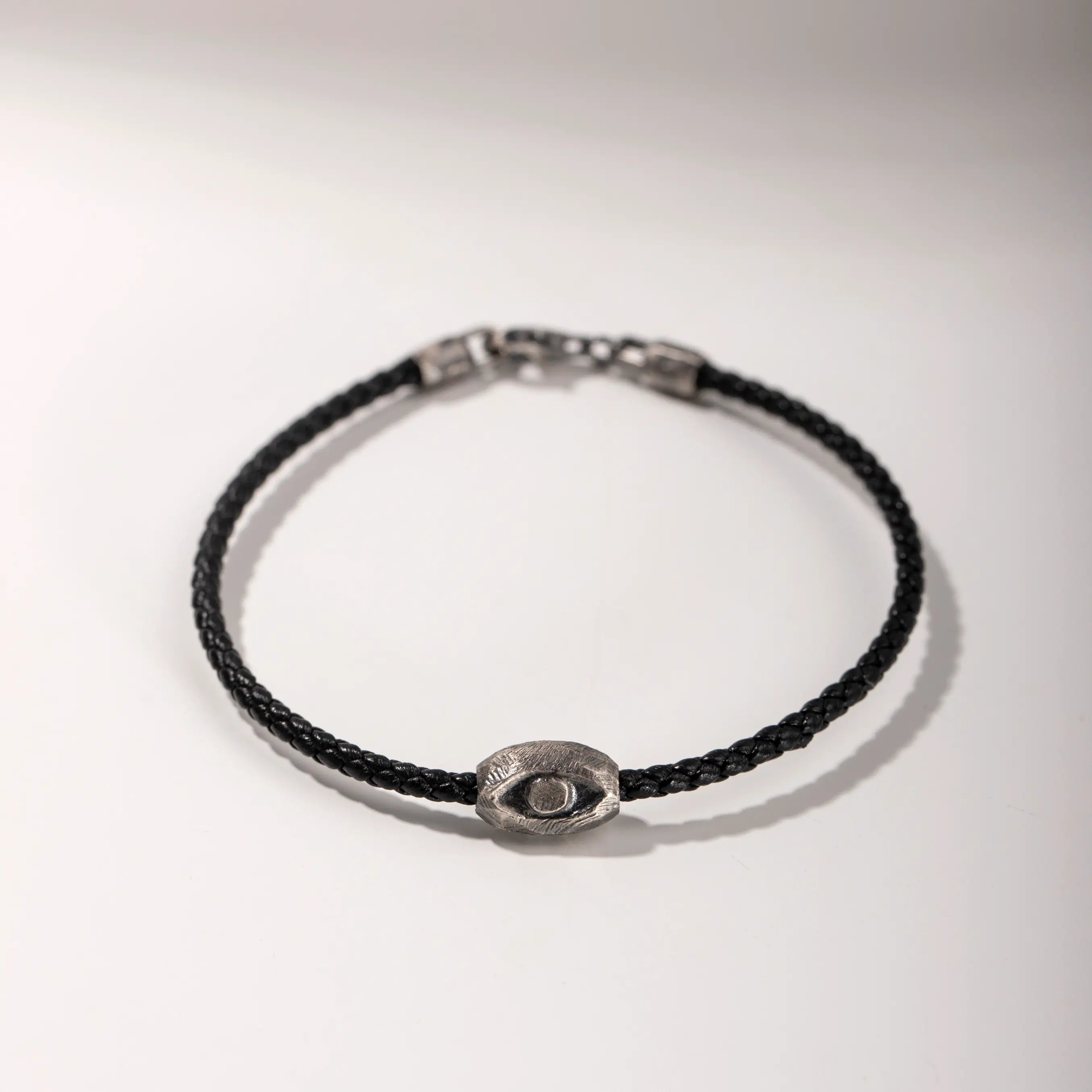 Evil Eye Bracelet Black Leather with handmade oxidized silver charm on black leather cord, perfect men's accessory.