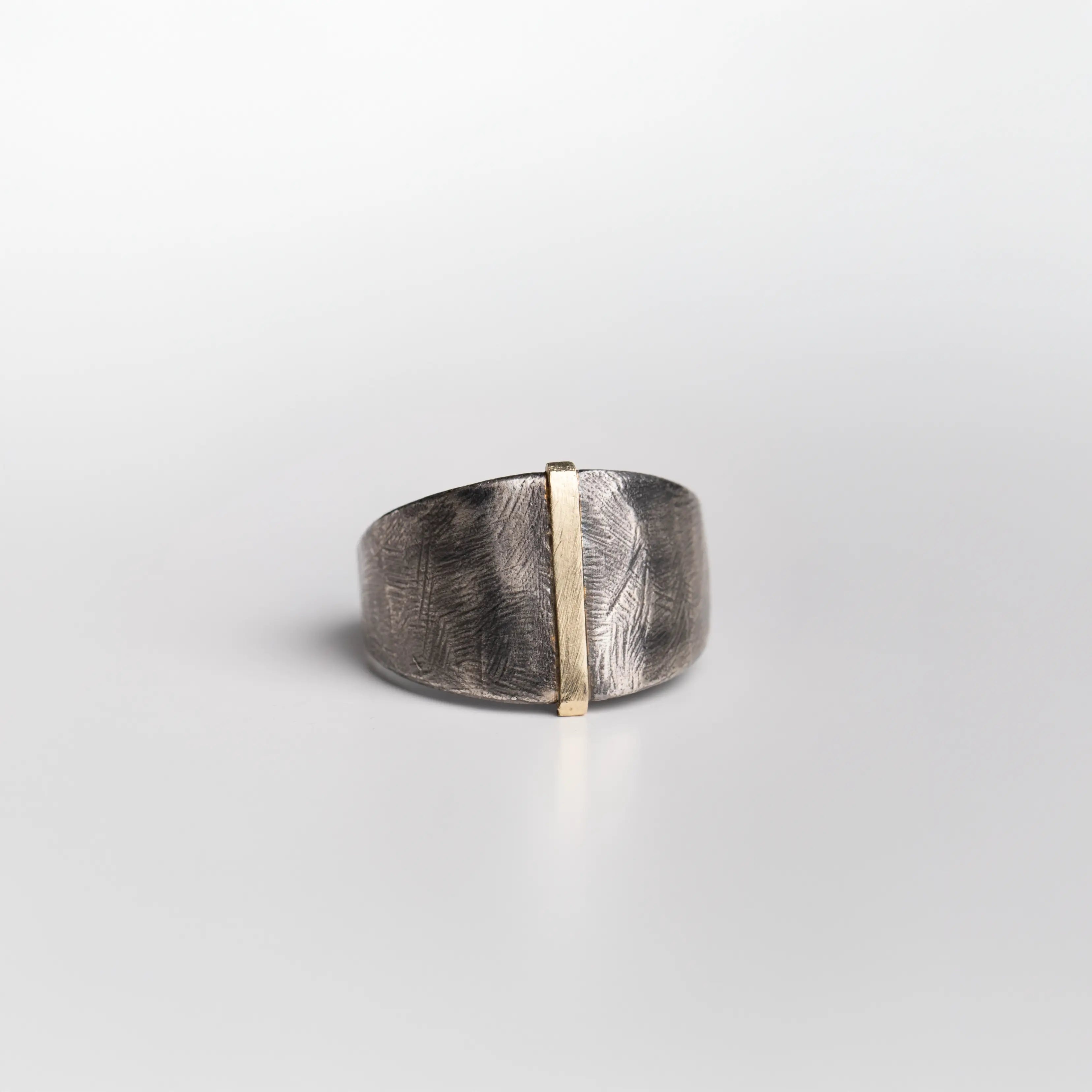 14K Gold & Oxidized Silver 925 Ring showcasing a brutalist style with oxidized silver and gold accent.