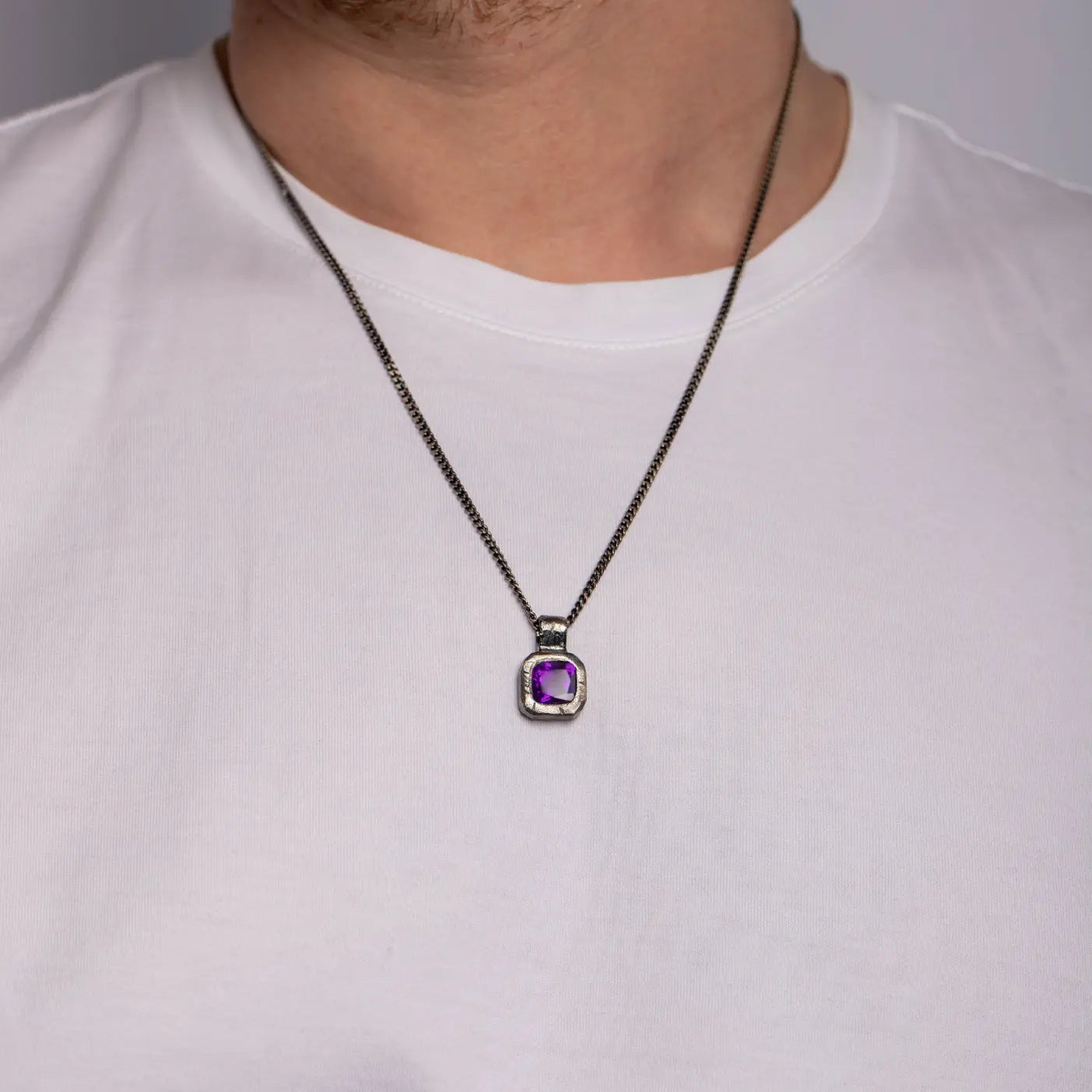 Purple Amethyst Necklace Oxidized Silver 925 on model, hand-carved pendant, unisex brutalist style, sterling silver 925 with black oxidized finish.