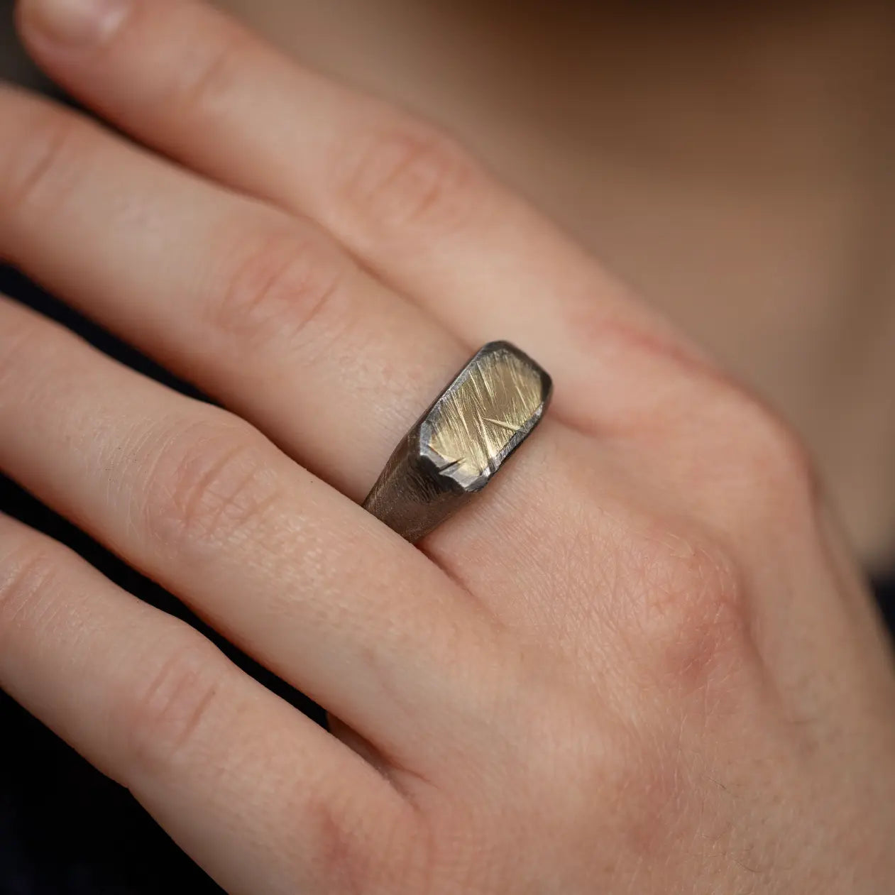 14K Gold Oxidized Silver 925 Signet Ring on hand, showcasing handcrafted brutalist design, ideal men's gift with black oxidized finish.
