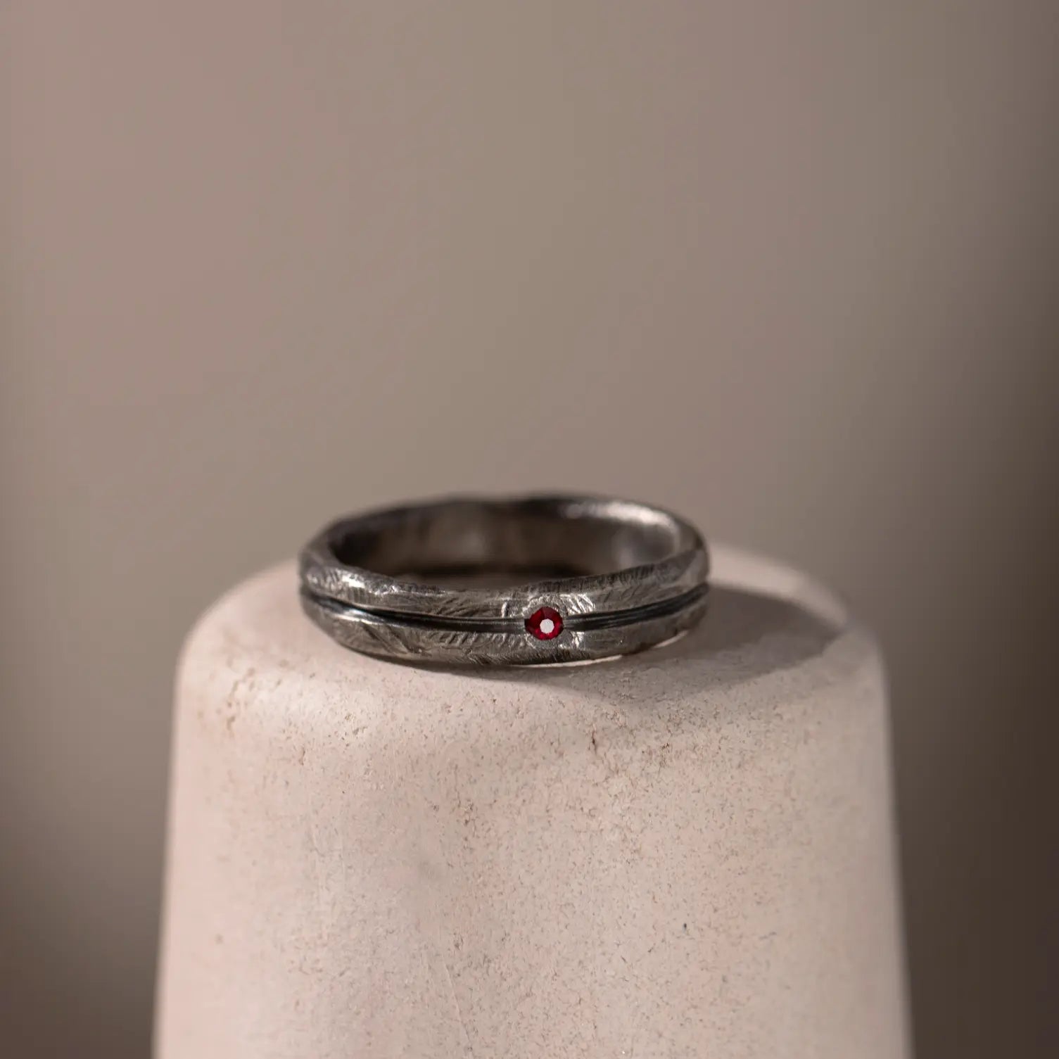 Ruby Narrow Band Ring Oxidized Silver 925 with a 2mm natural ruby 0.03ct, brutalist style for men. Width: 5mm.