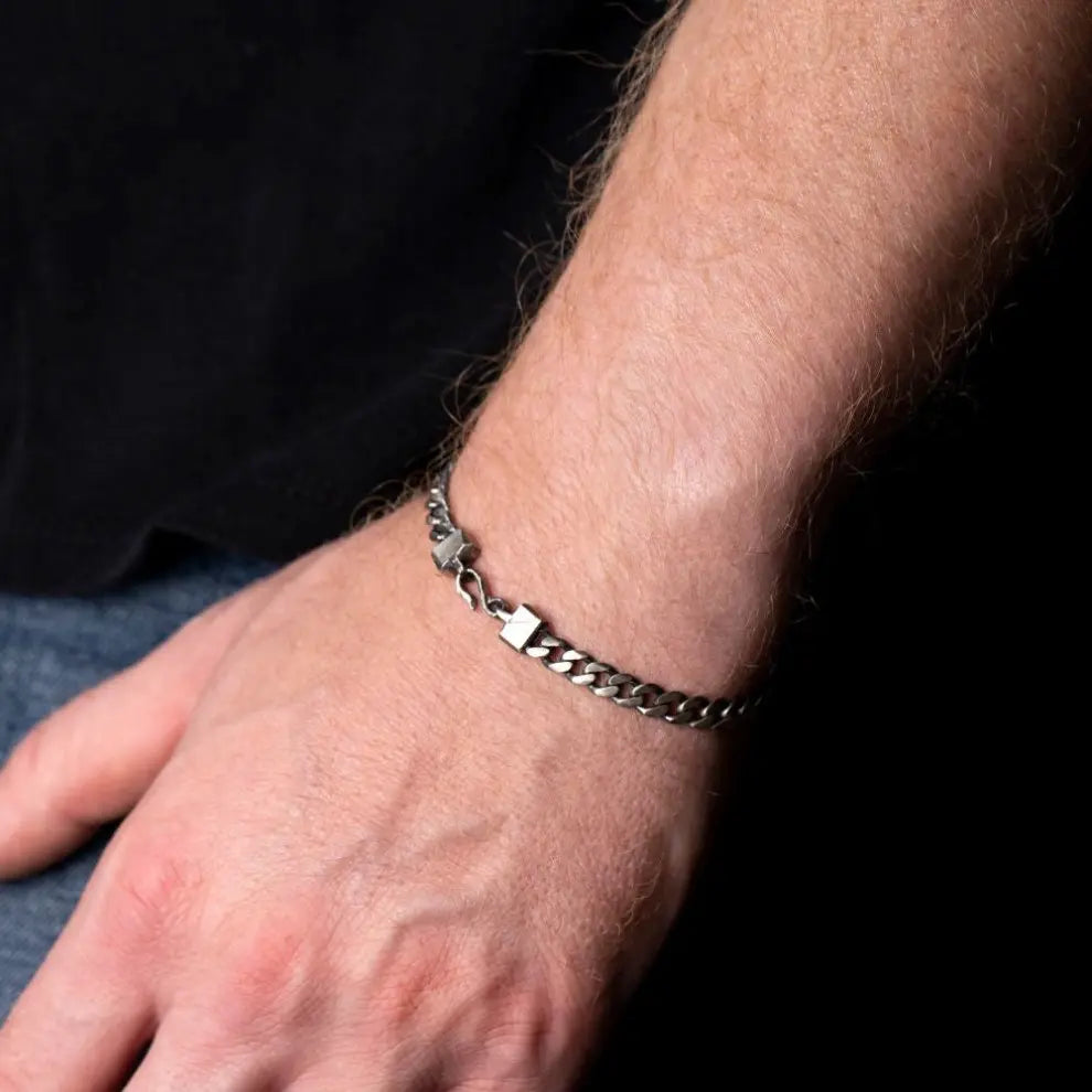 Man wearing 5mm oxidized sterling silver curb chain bracelet with unique handmade hook closure, perfect gift. Chain Bracelet Oxidized.