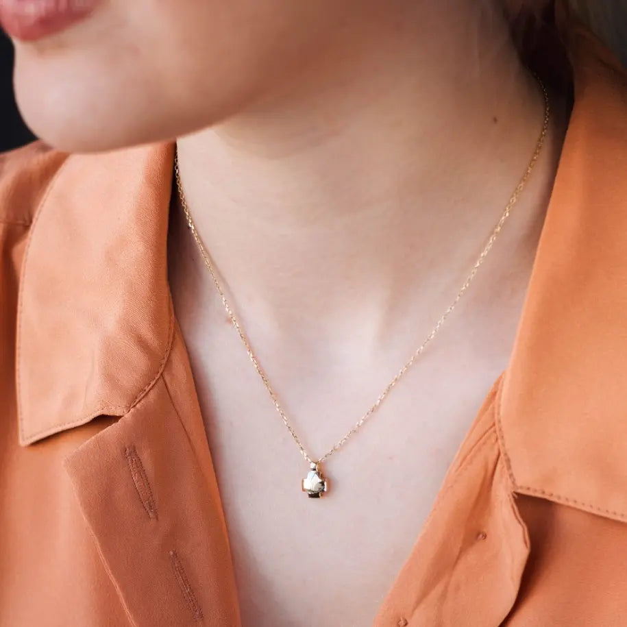 Geometrical Cross 14K Gold on a model