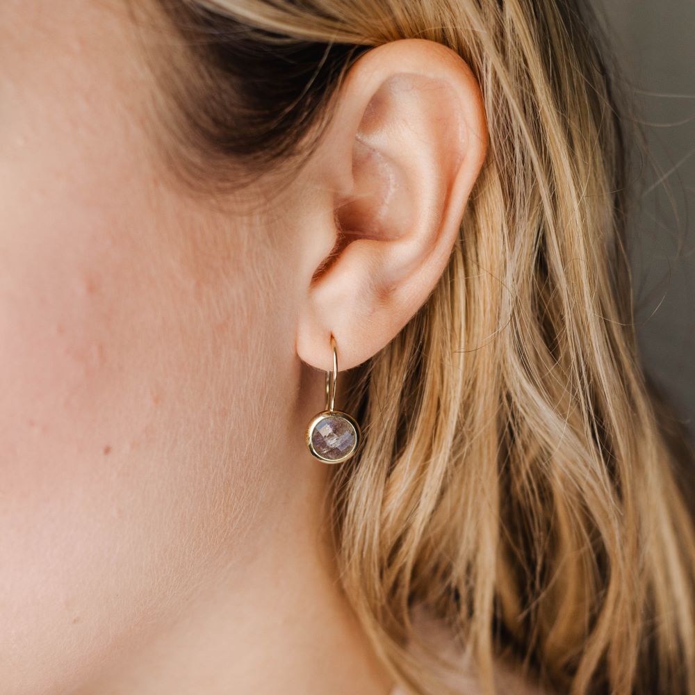 Woman wearing 8mm Labradorite Earrings in 14K gold showcasing elegant design.