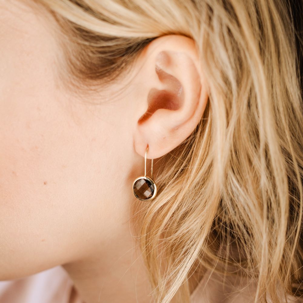 Smoky Quartz Earrings 10mm 14K Gold worn on ear, showcasing handcrafted elegance and simplicity, available in various gemstone options.