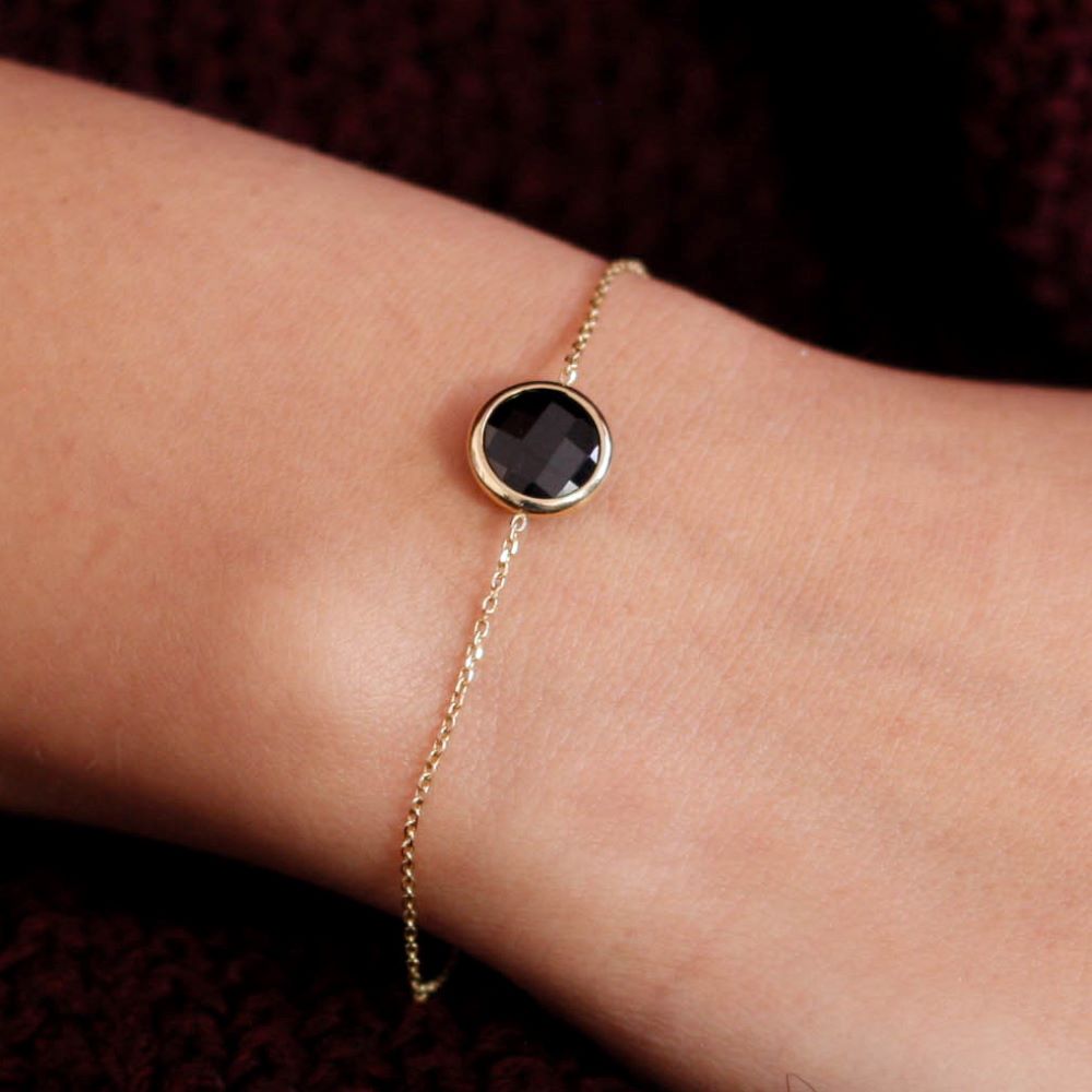 14K Gold Bracelet with 10mm Black Onyx on wrist, elegant handmade jewelry, perfect gift idea