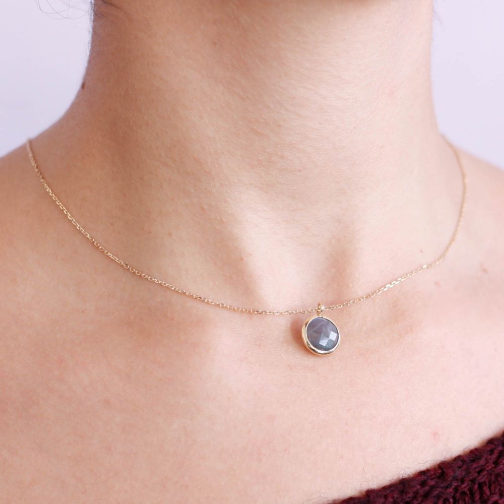 Labradorite Necklace in 14K Gold worn on neck, featuring a briolette Labradorite gemstone. Ideal as a gift. Elegant jewelry piece.