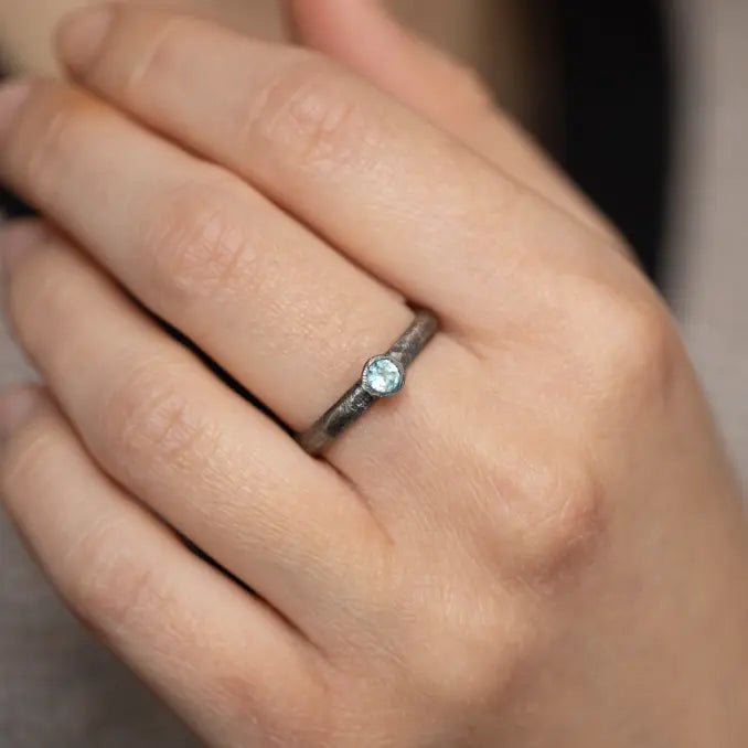 Swiss Blue Topaz Ring Oxidized Silver 925 on hand, handcrafted sterling silver with blue gemstone, elegant brutalist style.