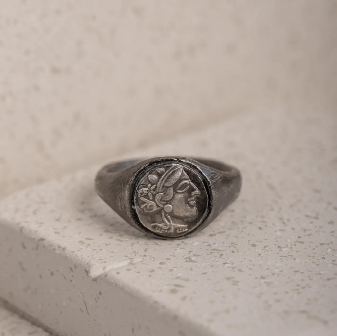Greek Goddess Athena Ring Oxidized Silver with intricate design on stone surface