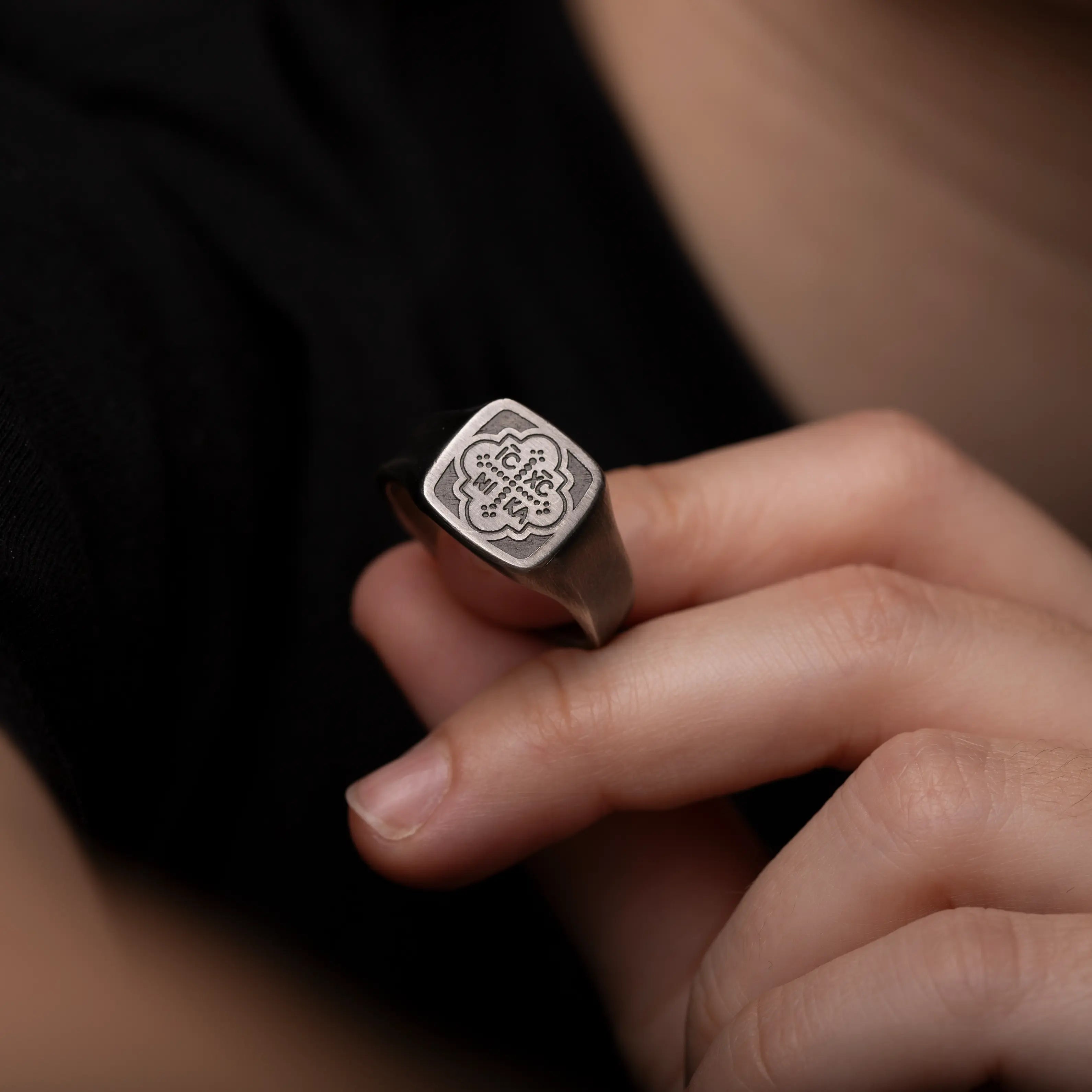 ICXC NIKA Signet Ring crafted from oxidized silver with a distinctive geometric design and Byzantine inscription.