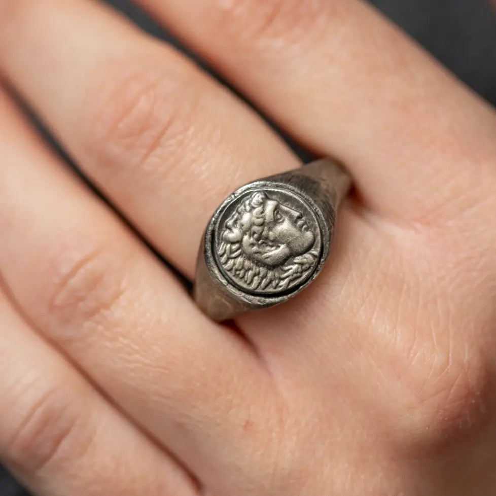 Close-up of Alexander the Great Ring Oxidized Silver on a hand, displaying its intricate design and craftsmanship.