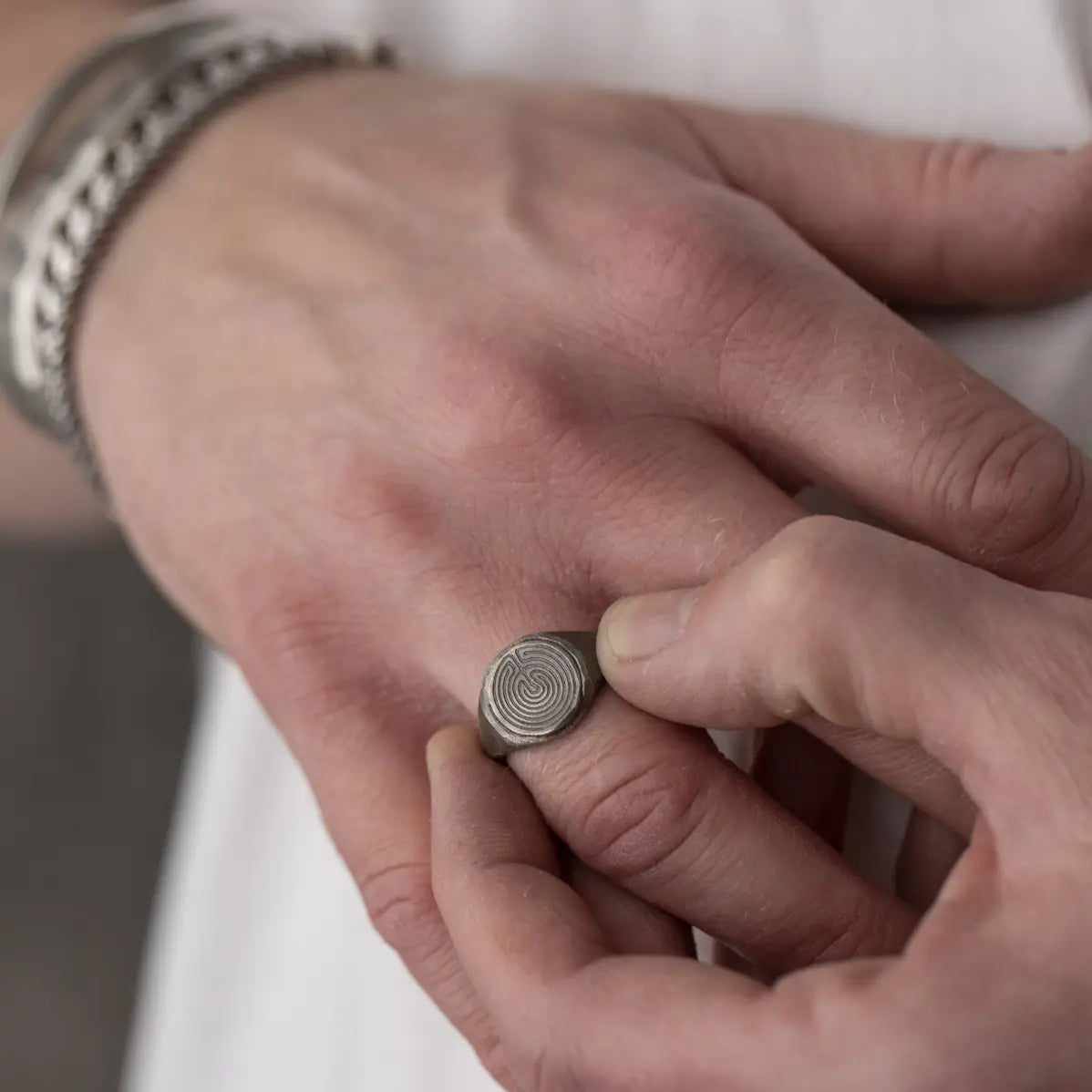 Labyrinth Ring Oxidized Silver 925 being worn on a finger, showcasing its intricate design and craftsmanship in a close-up.