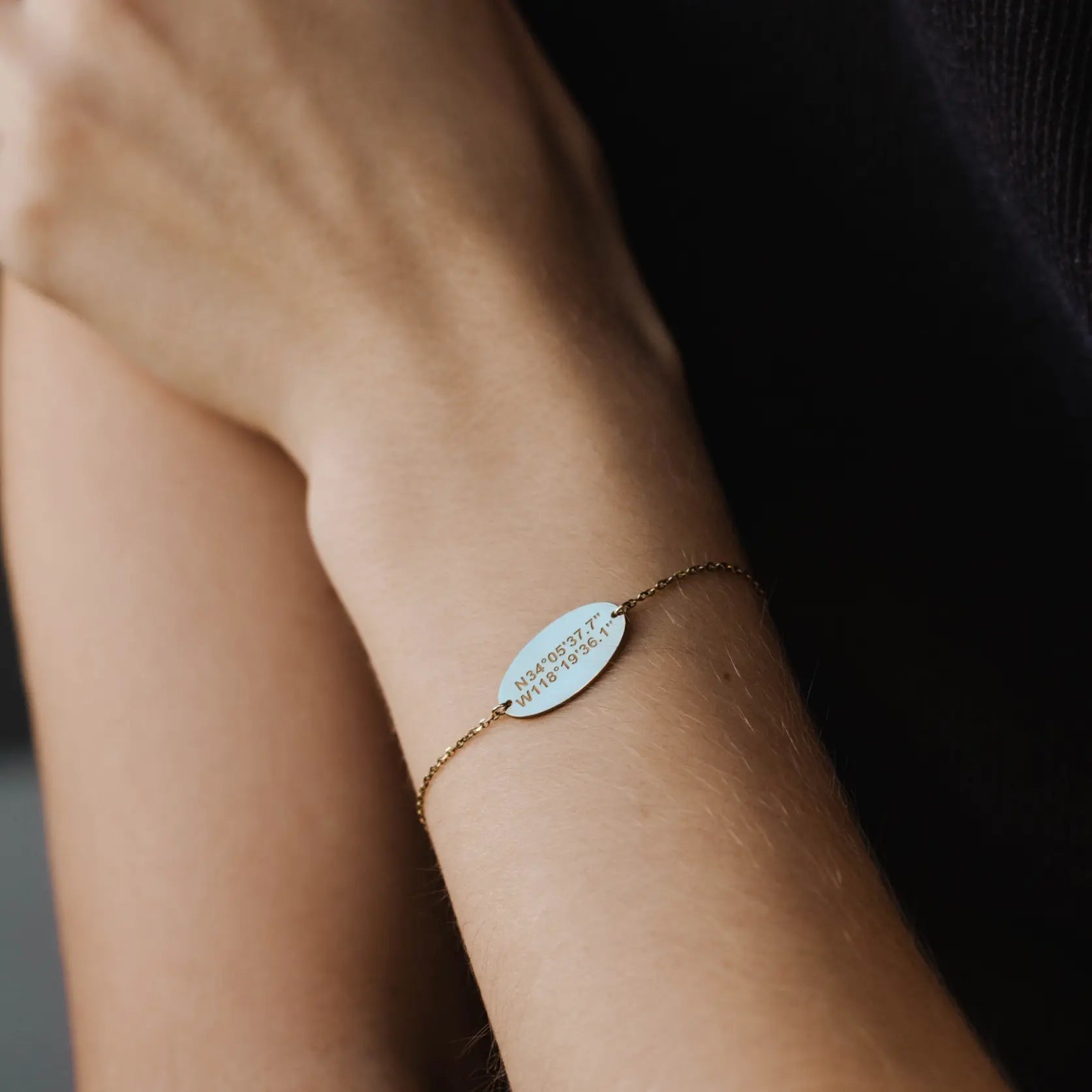 Personalized Bracelet Coordinates Sterling Silver 925 with engraved coordinates on wrist, minimalist oval design.