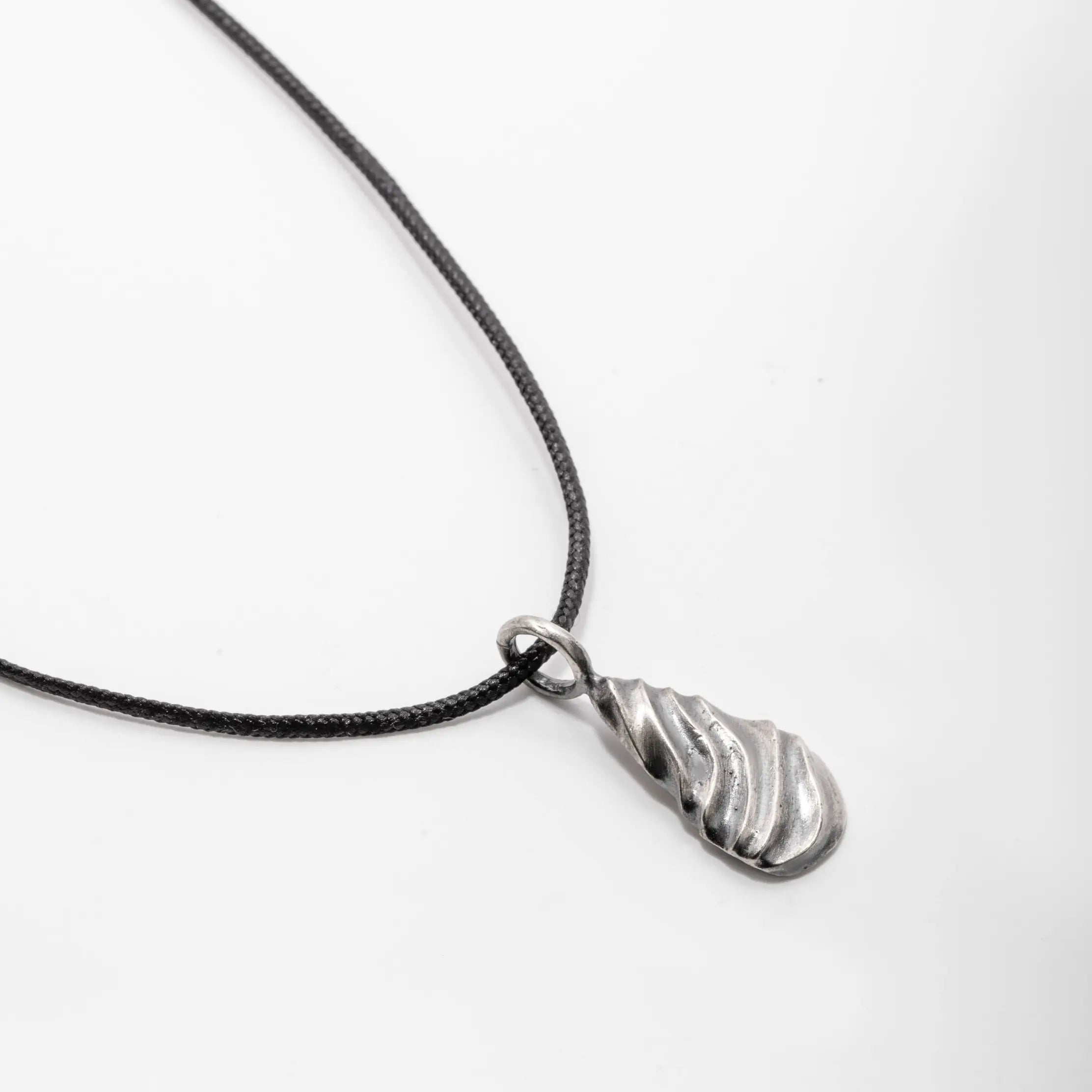 Wavy Pendant Necklace Oxidized Silver with wave design on black cord