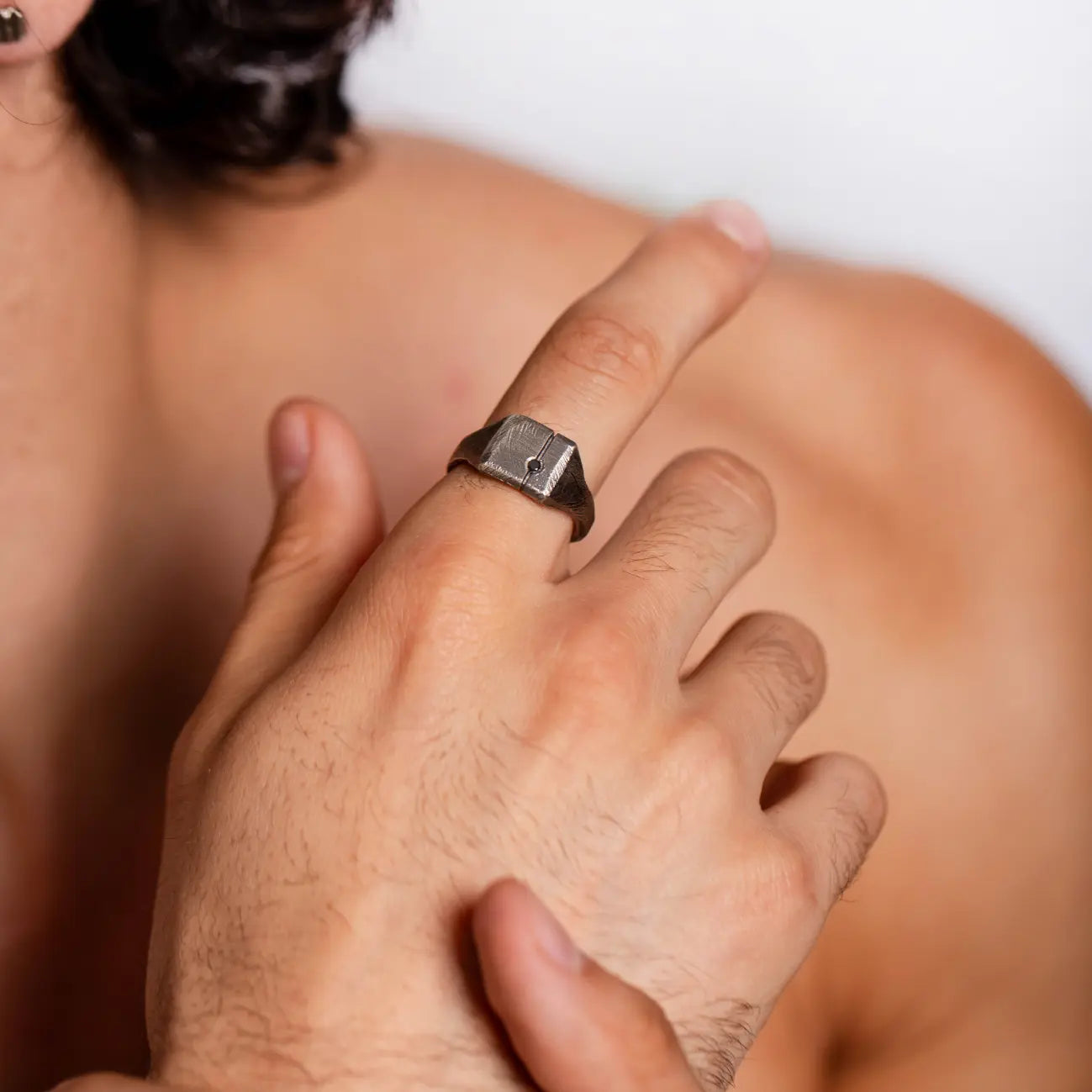 Black Diamond Square Ring Silver 925 on a man's hand, featuring a natural black diamond with an oxidized finish for a stylish look.