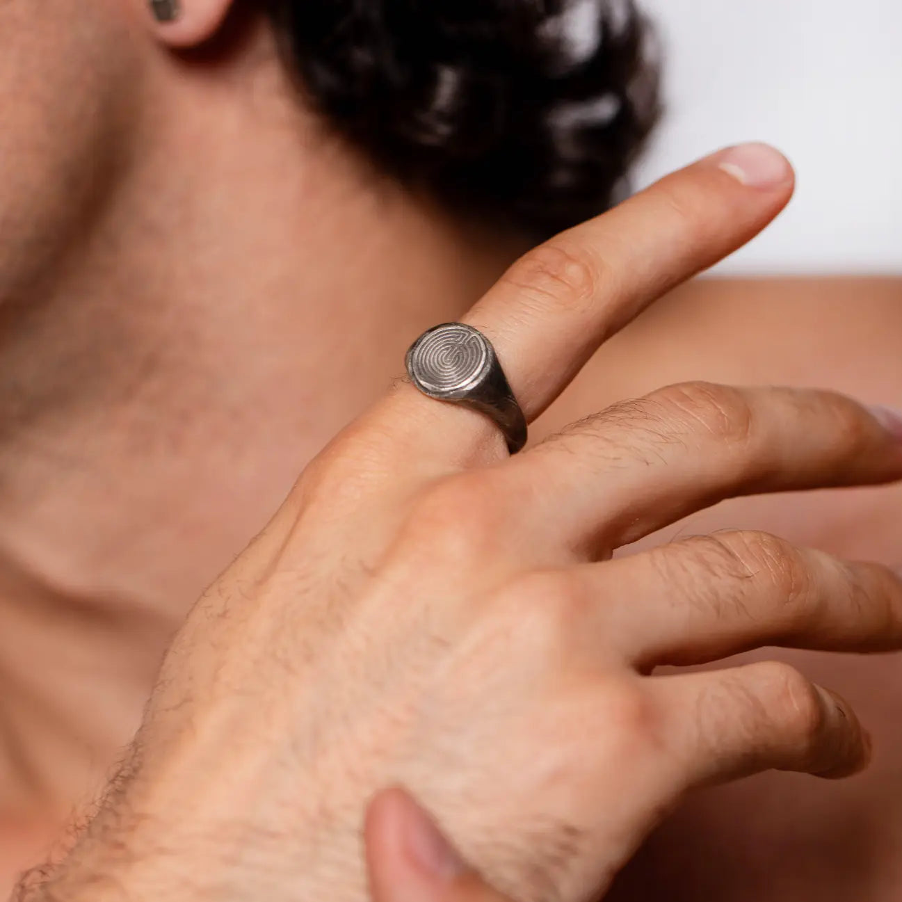 Labyrinth Ring Oxidized Silver 925 on man's hand, featuring intricate Greek-inspired design.