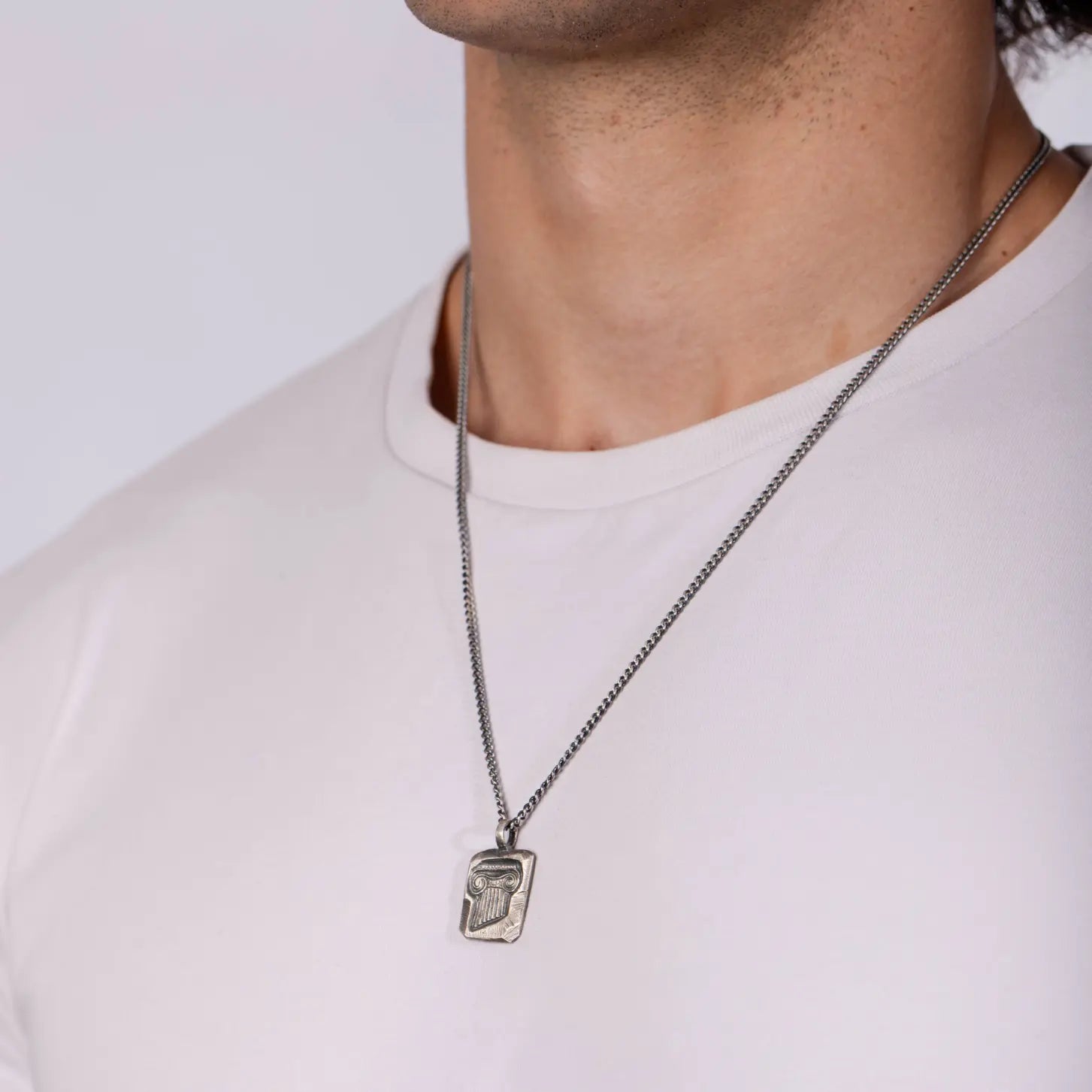 Ancient Greek Column Necklace Oxidized Silver 925 worn on model, showcasing detailed design and oxidized silver finish.
