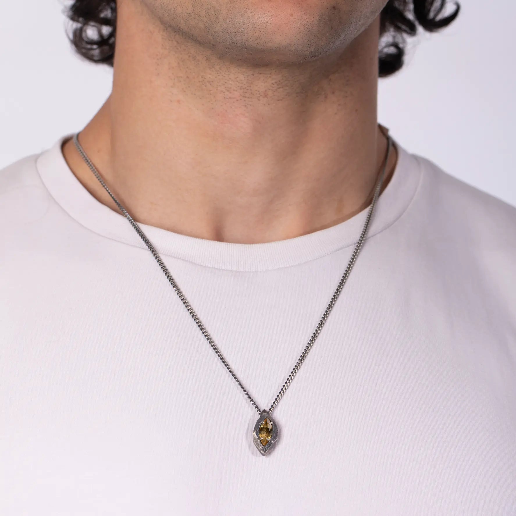 Citrine Necklace Oxidized Silver Marquise worn by a model, showcasing a marquise-cut citrine pendant in black oxidized silver.