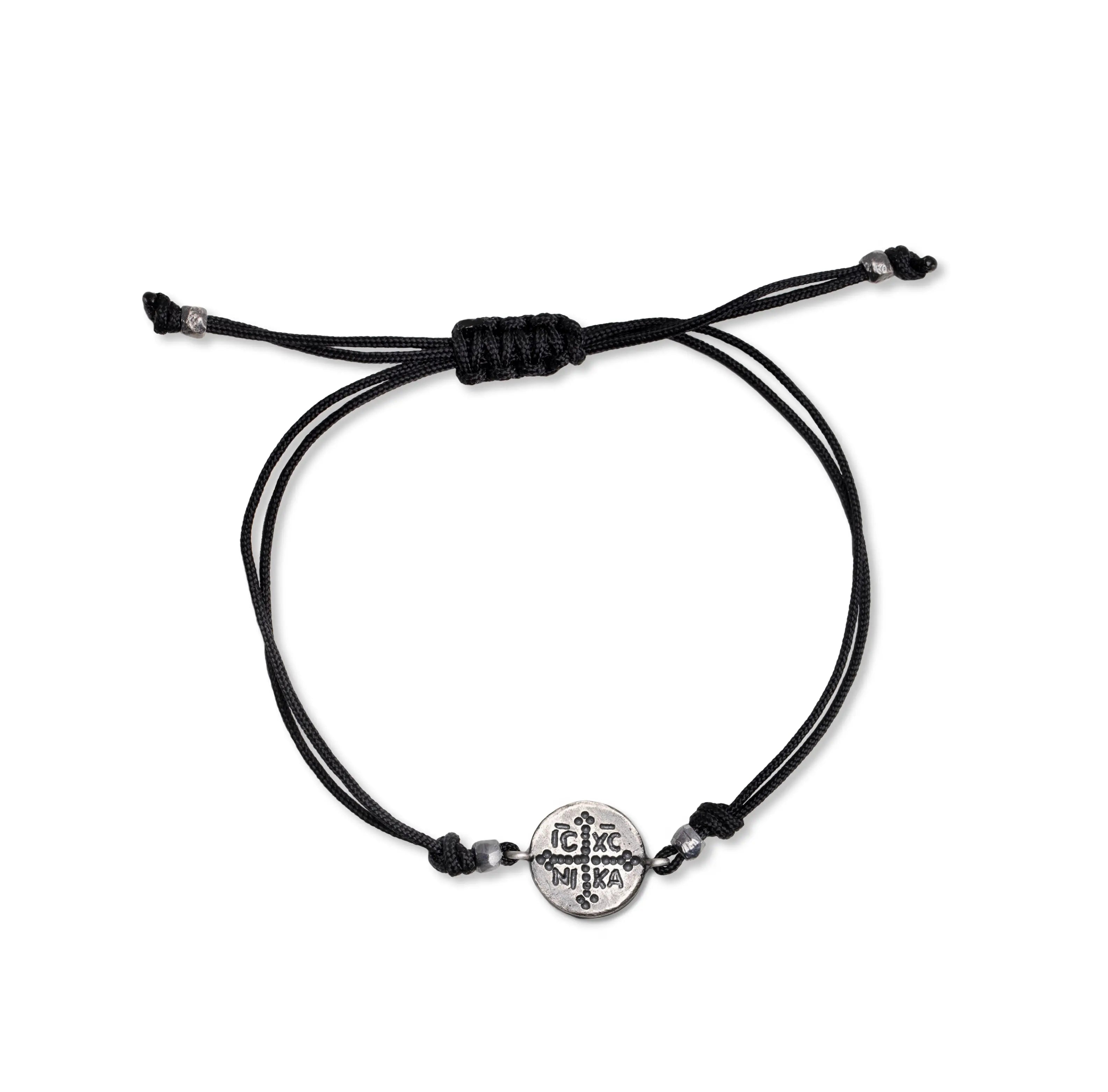 ICXC NIKA Bracelet with Black Cord featuring a minimalist design and Byzantine-inspired charm.
