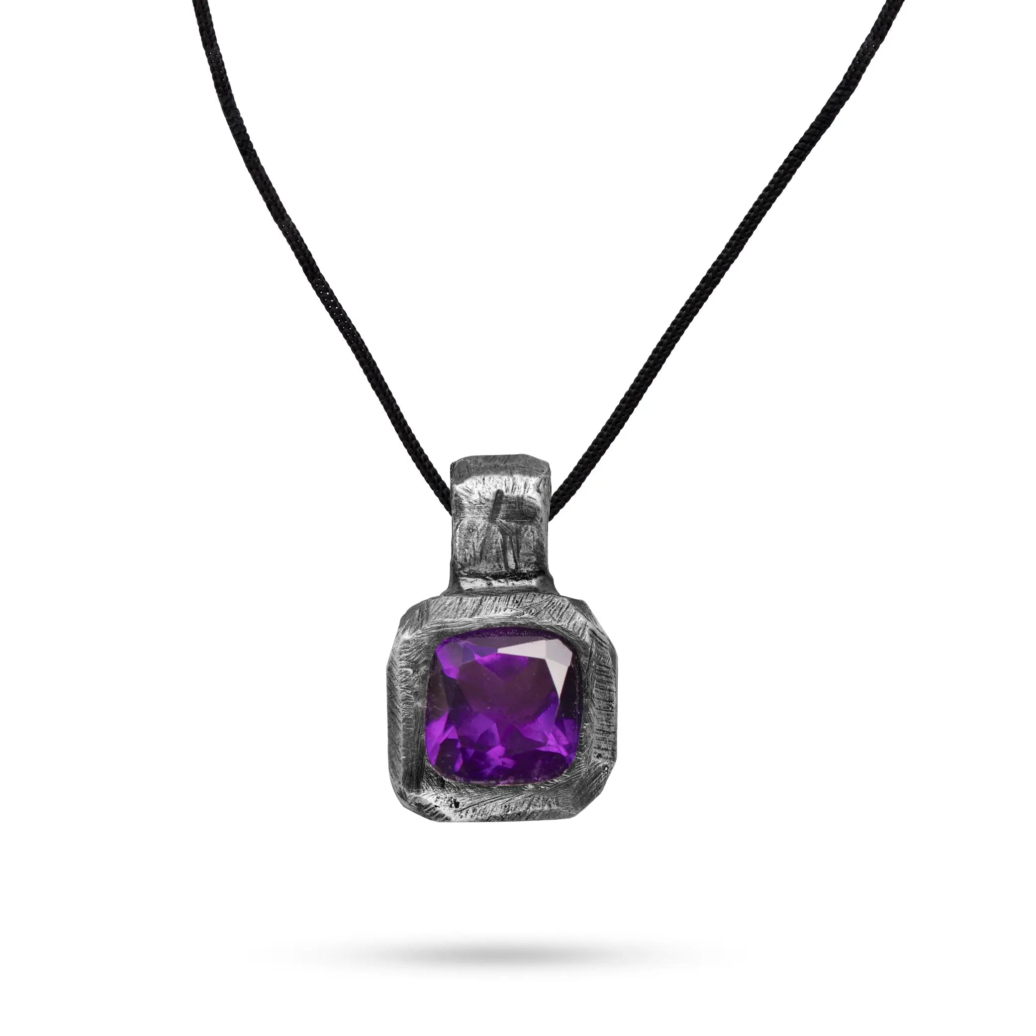 Purple Amethyst Necklace Oxidized Silver 925 with hand-carved pendant and gemstone on a black cord.