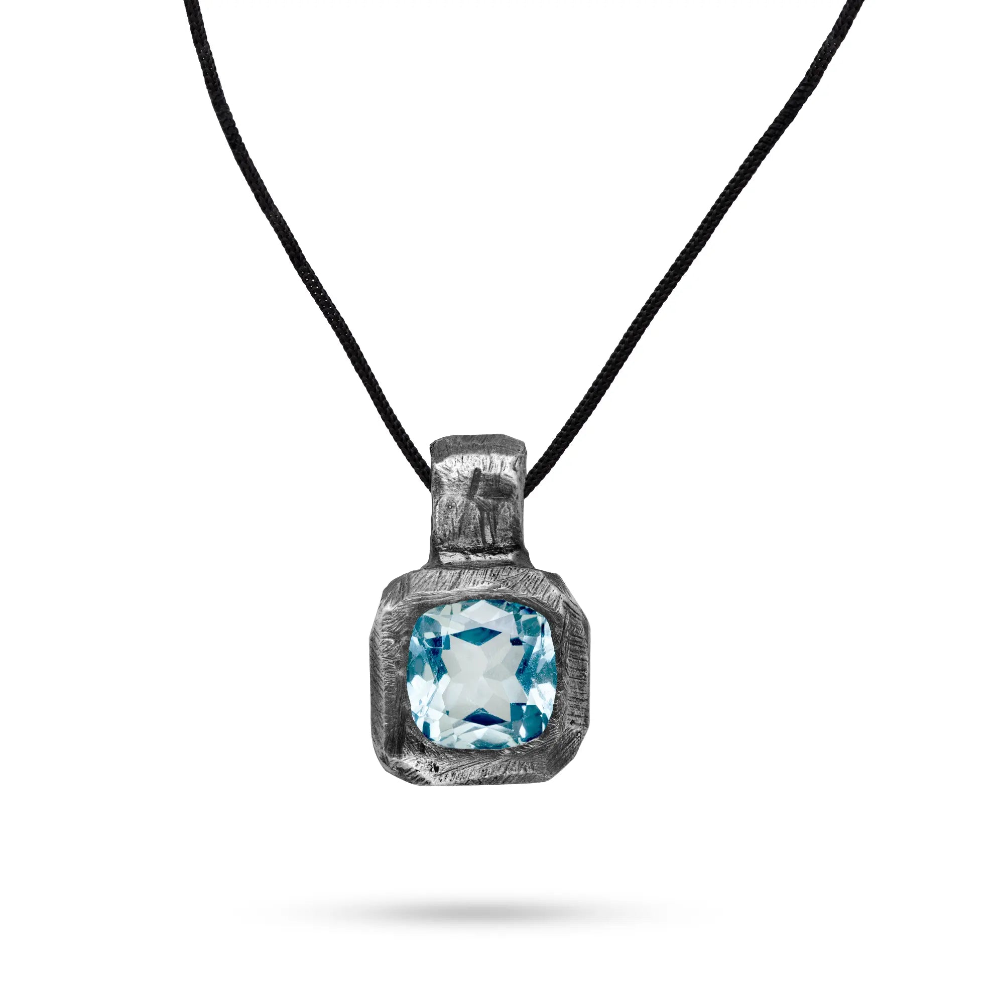Blue Topaz Necklace Oxidized Silver 925 with hand carved sterling silver pendant on black oxidized finish and curb chain.