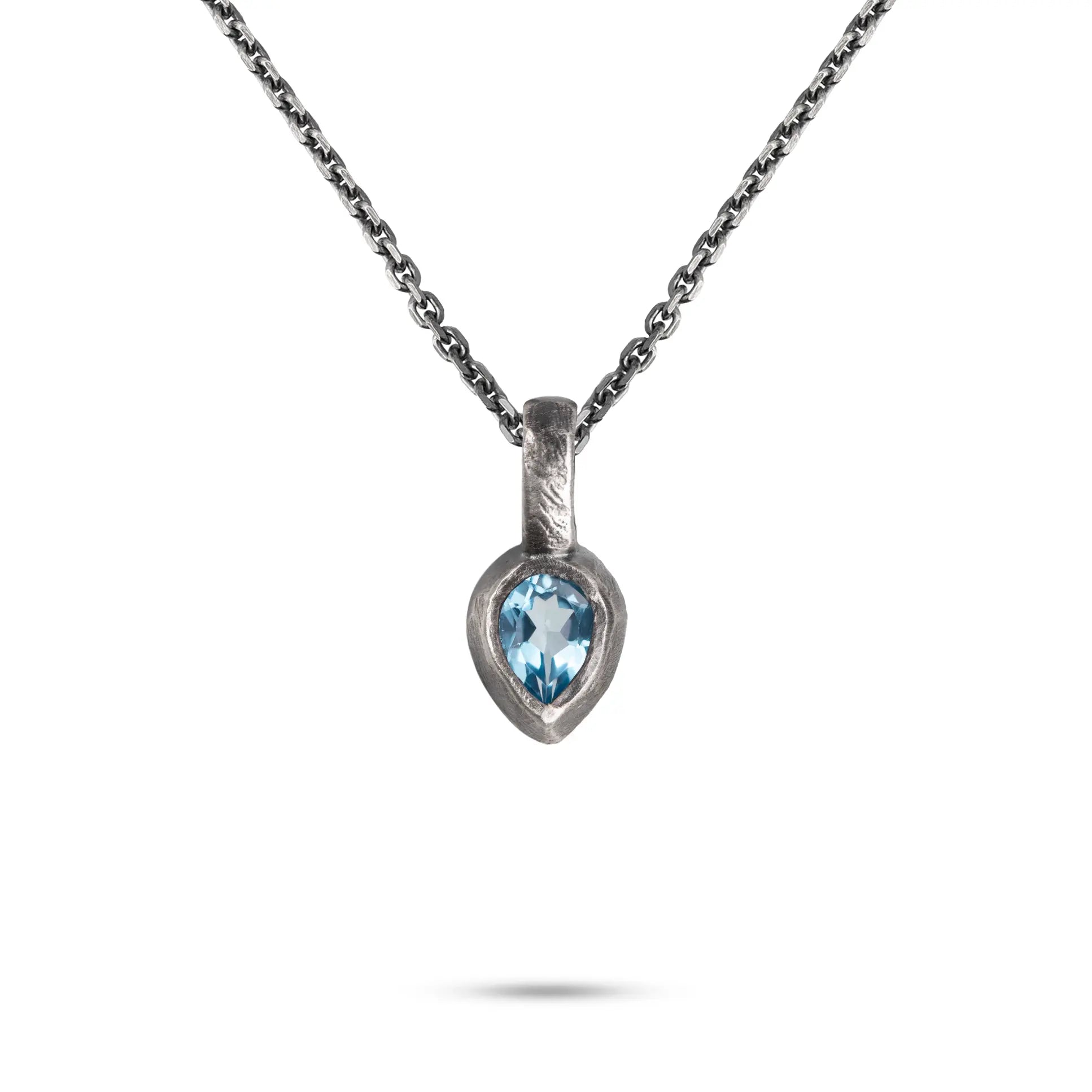 Blue Topaz Necklace Sterling Silver 925 featuring a hand-carved pendant with vibrant blue topaz.