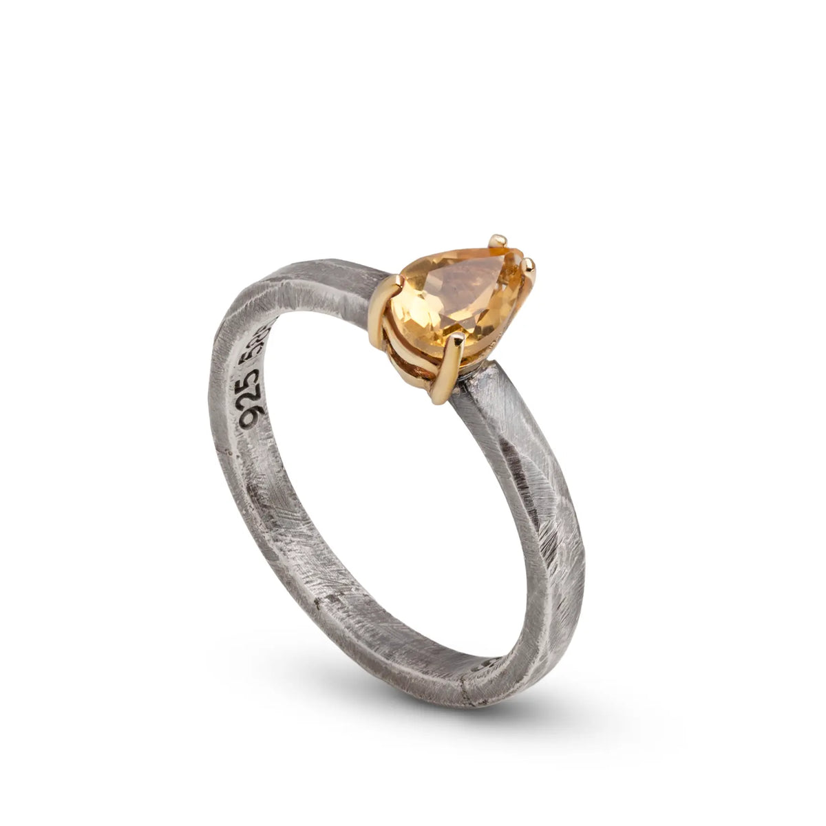 Citrine Ring In Silver And Gold featuring a pear cut citrine stone in a silver and gold setting.