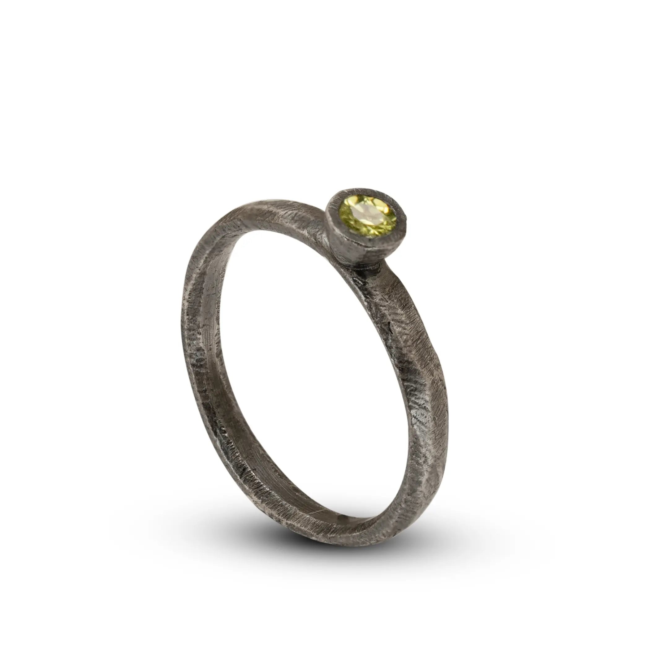 Handcrafted oxidized silver 925 ring featuring a brilliant 0.16ct peridot stone, perfect for a unique engagement or gift option.