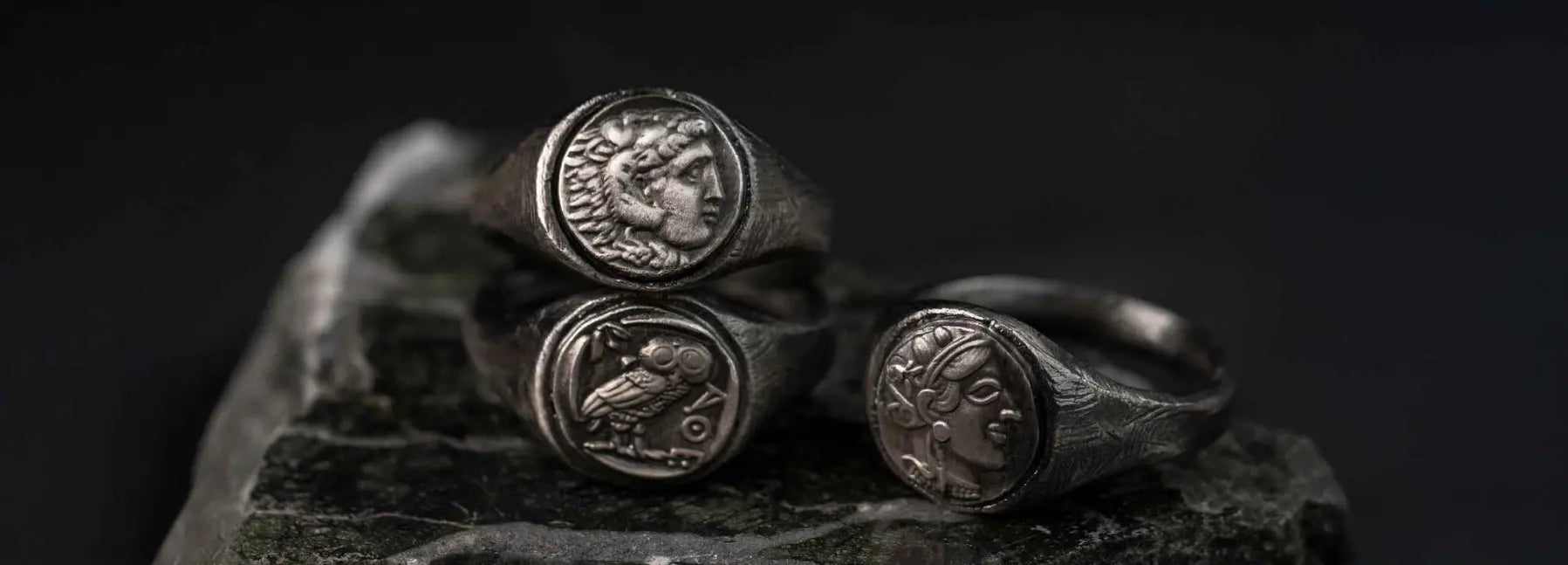 Three silver signet rings with inserts, Alexander the Great, Athena's owl, and Athena