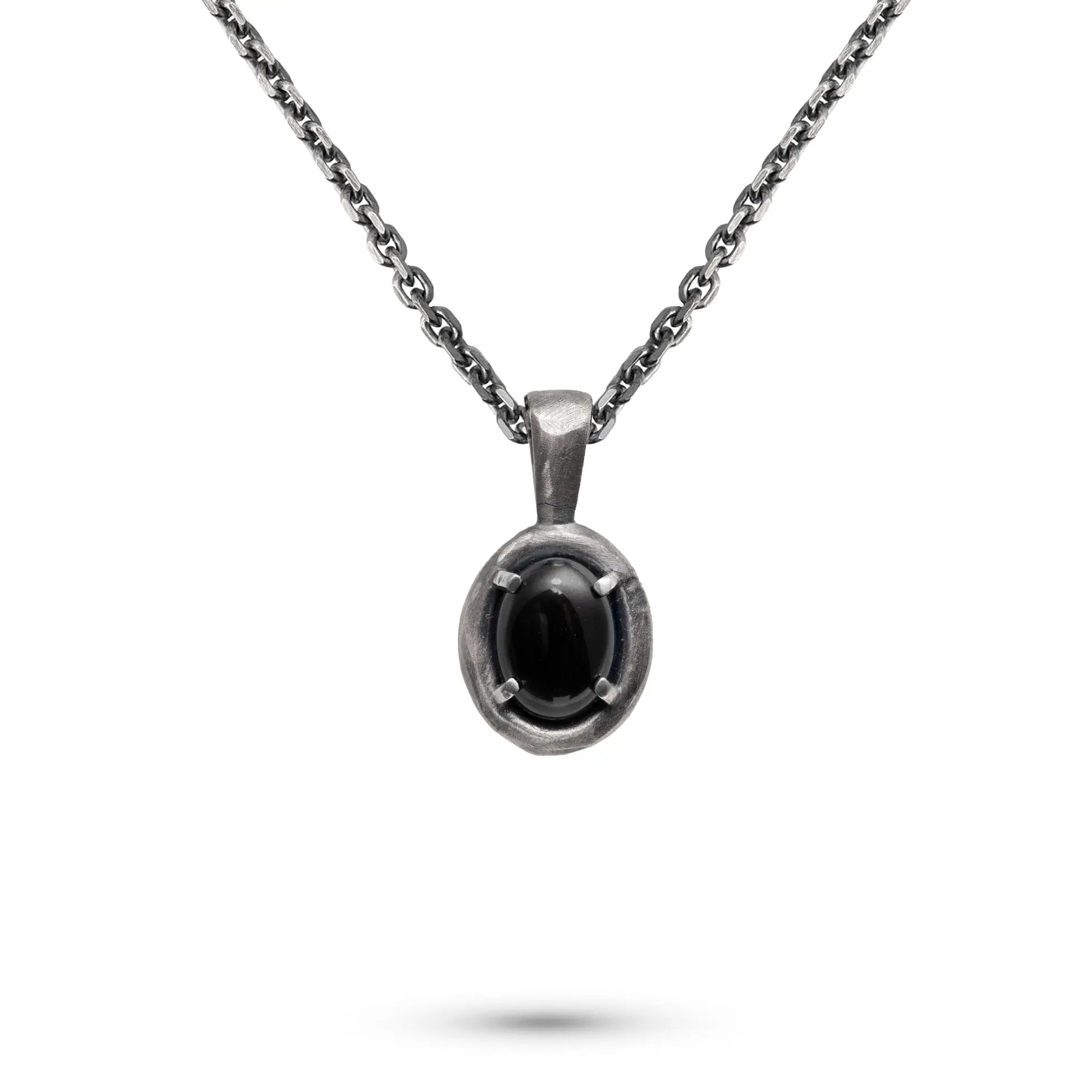 Black Onyx Necklace Oxidized Silver 925 with an oval pendant on a chain, showcasing its unique design.