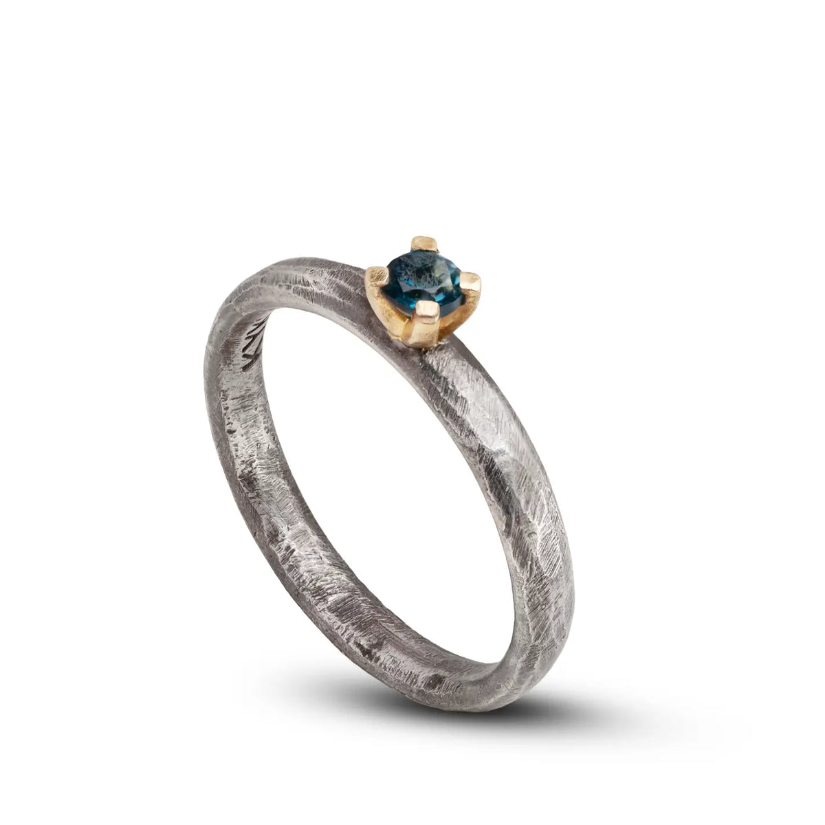 London Blue Topaz Engagement Ring In Silver And Gold featuring a 0.19ct gemstone, handcrafted in silver and gold.