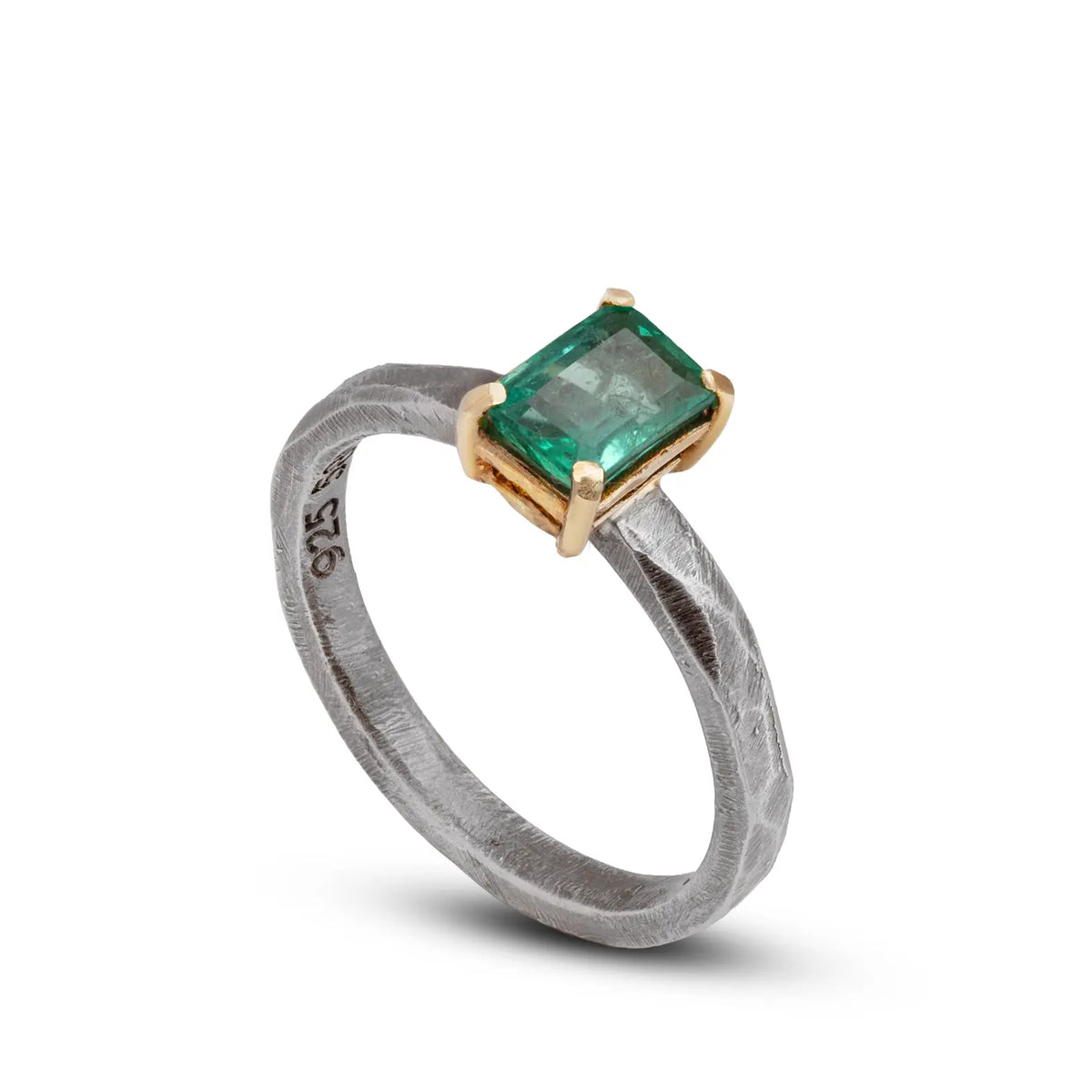 Emerald Ring In Silver And Gold featuring a stunning 0.87ct emerald in a unique silver and gold handcrafted design.